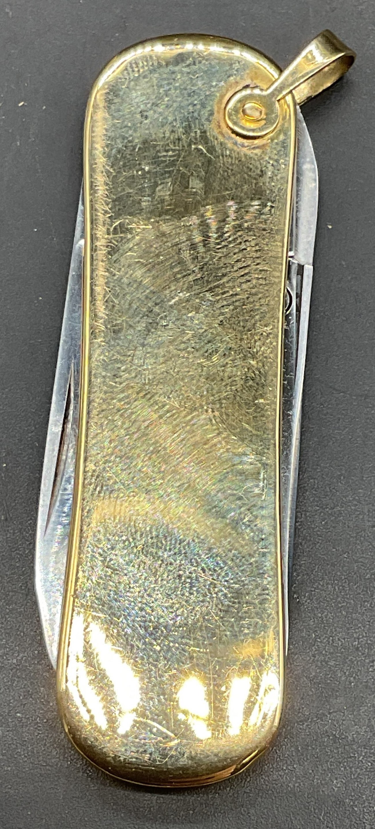 Latama 14k Gold Pocket Knife, Italy: Latama 14k gold and stainless steel pocket knife. Made in Italy. Marked JOST 14k on bail. Measures approx. 2.25 x .75 inches. Total weight including non gold 26.6 grams. Some scratching. Latama pocket