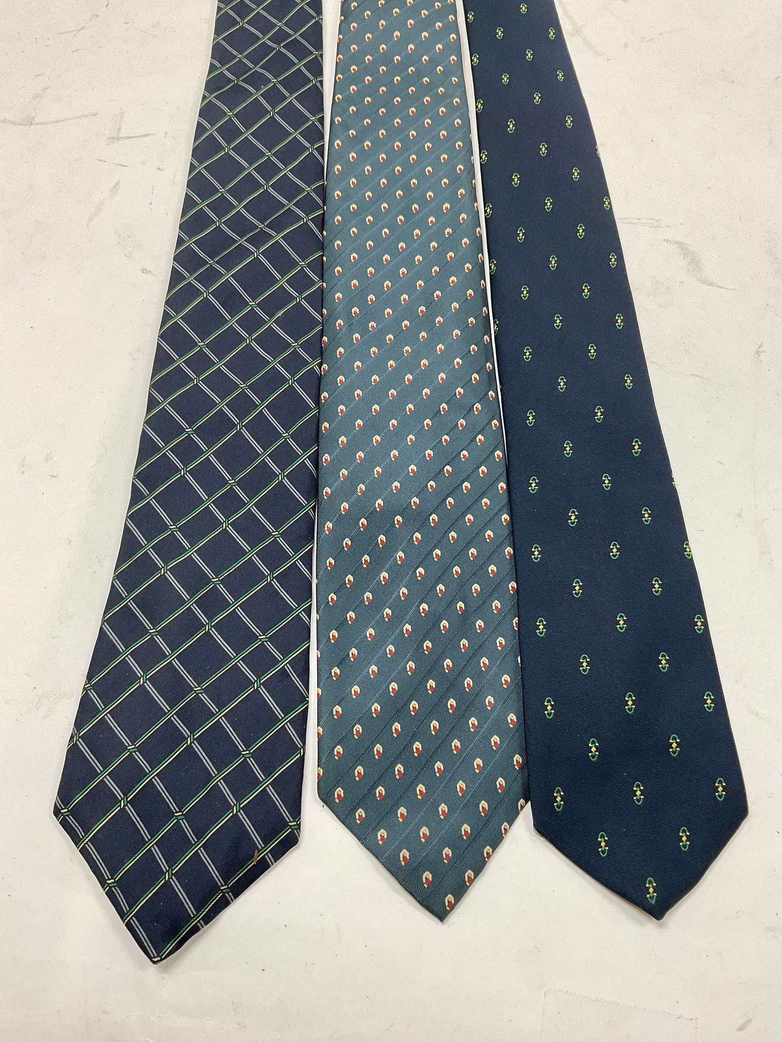Lt 3 Blue Ties Lily Dache Henri Christian+: 3 Blue Silk Designer Ties. Includes a Henri Christian Navy and Green Geometric Pattern Designed in Great Britain, a Cambridge Collection Blue and Red Patterned Tie Imported from Italy, and a Lily