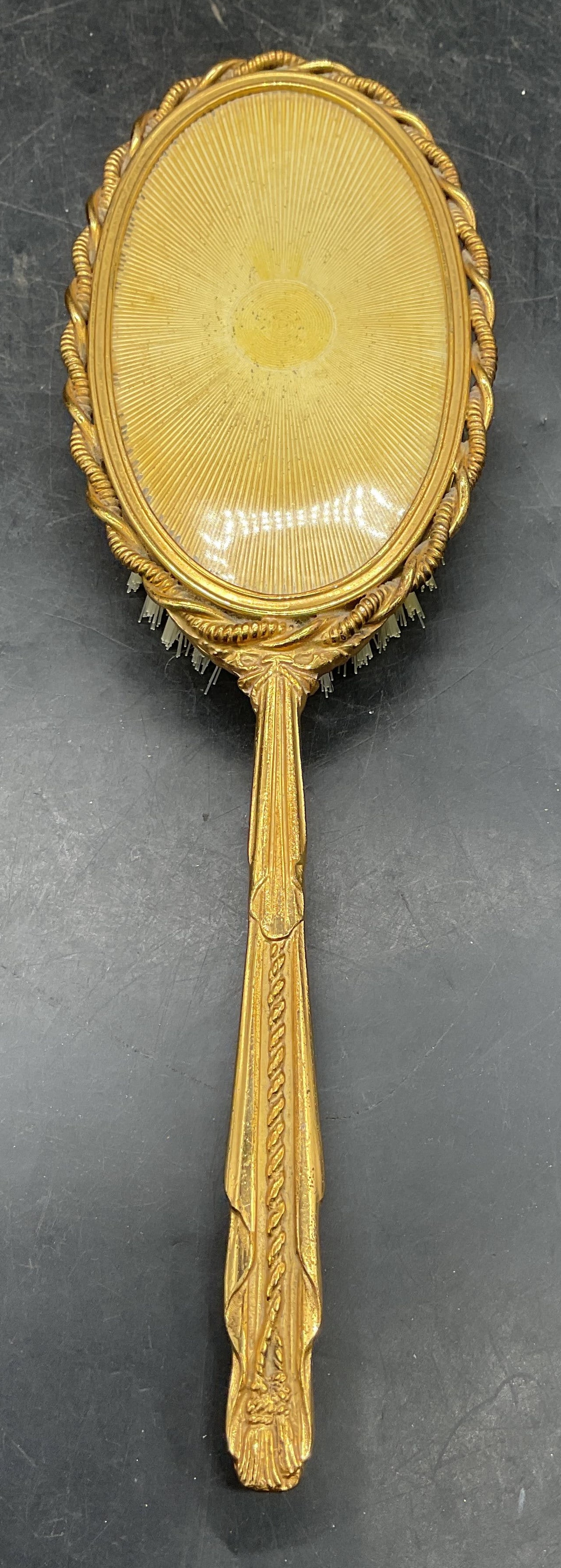 Vintage Ornate Gold Tone Faux Guilloche Hairbrush: Vintage ornate gold tone hairbrush with faux guilloche panel and nylon bristles. Measures approx. 10.25 x 3.25 inches. Some scratching. Gold tone hairbrush, vintage hairbrush, home accessories, vanity