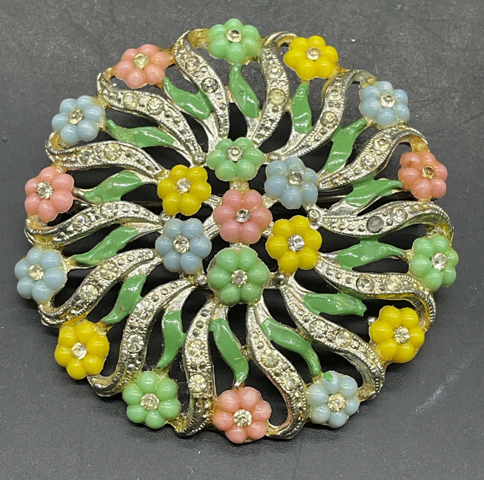 Vintage Silver Tone Enamel Crystal Flower Brooch: Vintage silver tone enamel and crystal flower brooch. Measures approx. 2 inches wide. Some crystals need replacement. Some scratching. Jewelry, estate jewelry, costume jewelry, cocktail jewelry, fashi