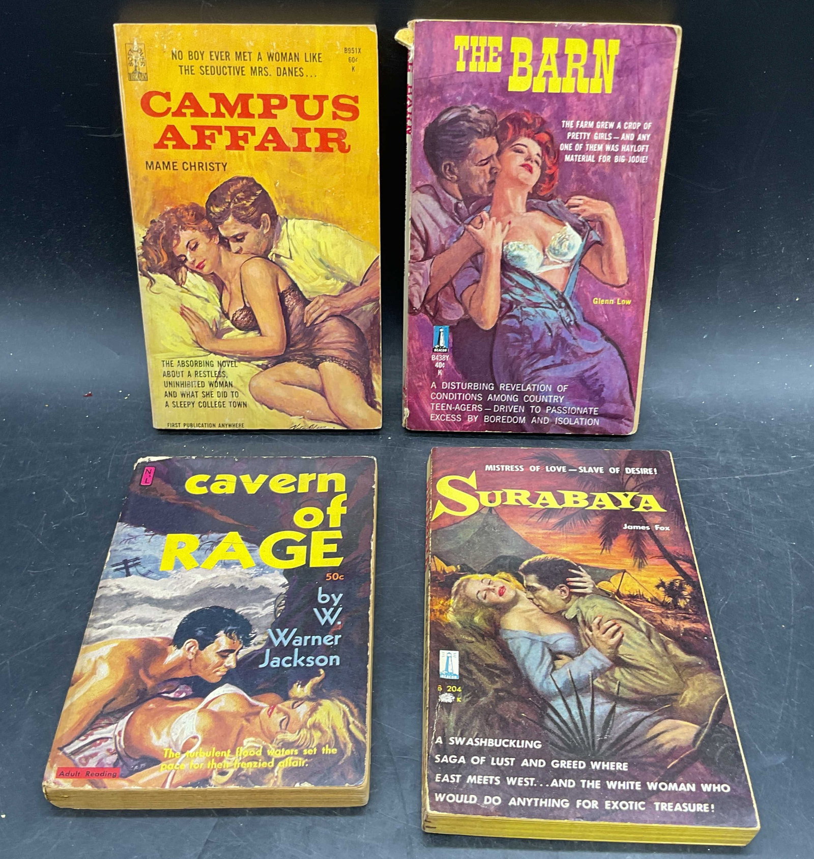 Lot 4 1950s/60s Pulp Fiction Erotica Books: Lot of 4 pulp fiction erotica paperback books. All published 1950s/1960s. Surabaya by James Fox. Cavern of Rage by W Warner Jackson. The Barn by Glenn Low. Campus Affair by Mame Christy. Measures appr