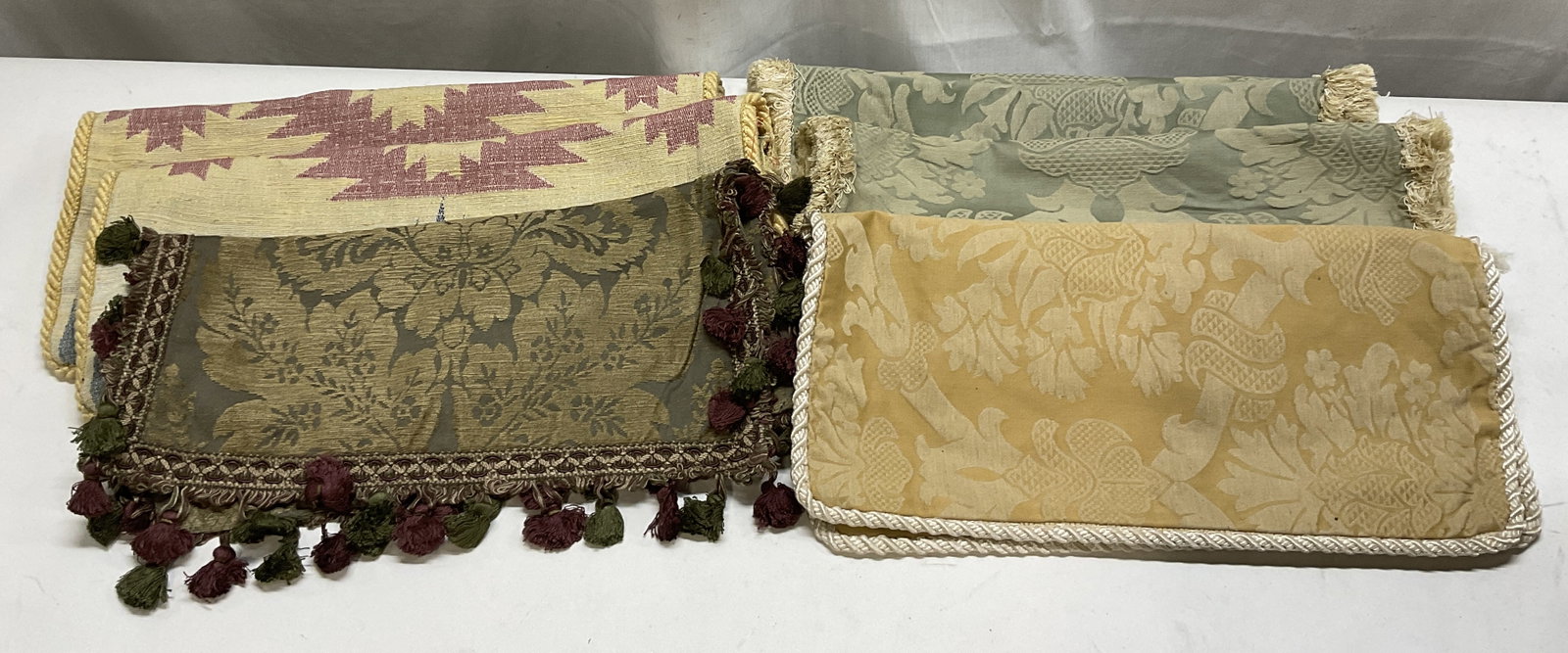 Lt 7 Vintage Throw Pillow Covers w/ Rope Trim: 7 Vintage Throw Pillow Covers with Rope Trim. Includes 2 Southwestern Style Geometric Patterns, 3 Light Green Floral Patterns, An Olive Green Floral Pattern with Maroon and Green Trim, and a Yellow