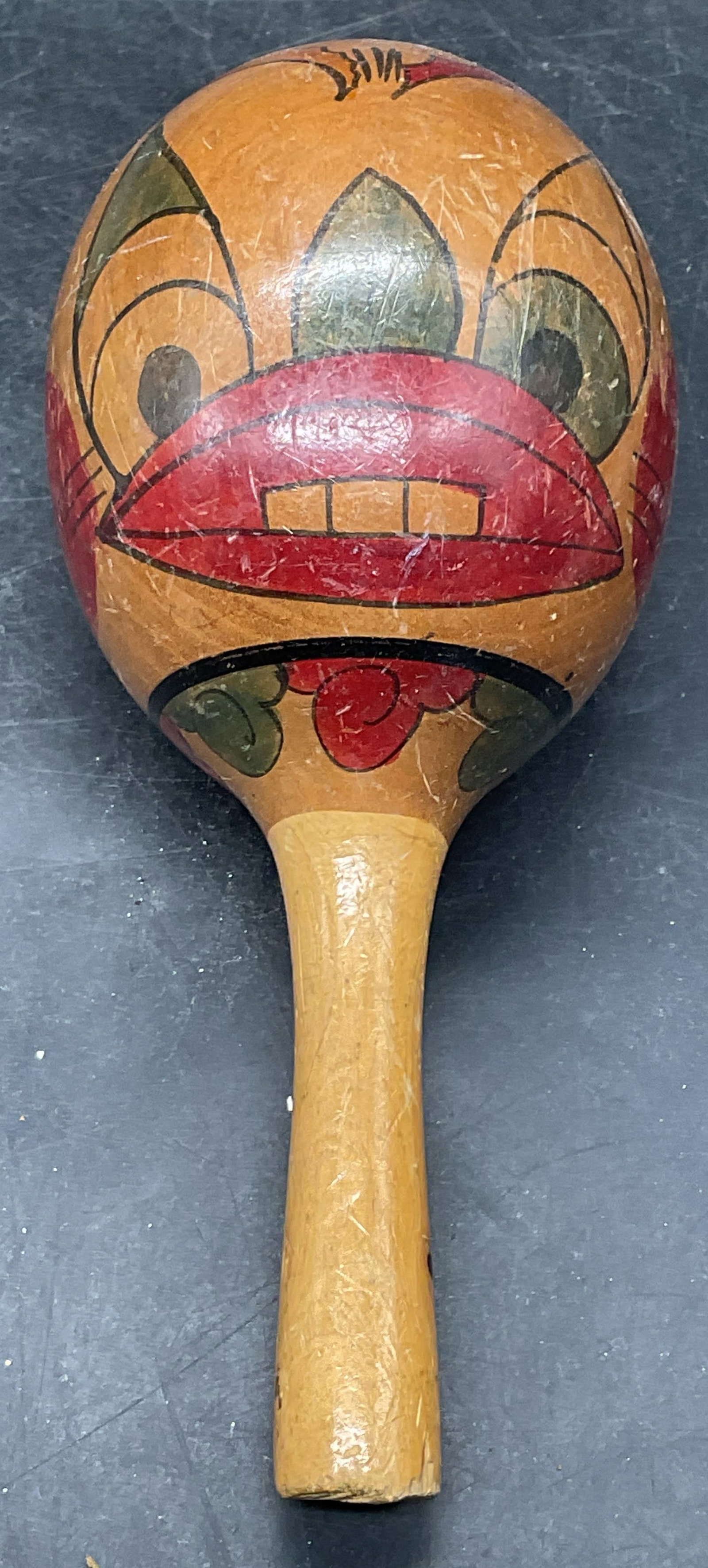 Vintage Wood Figural Maraca, Mexico: Vintage hand painted wood maracas with figural motif. Made in Mexico. Measures approx. 7 x 3 inches. Some scratching and loss to paint. Maraca, vintage maraca, wood maraca, home decor, home
