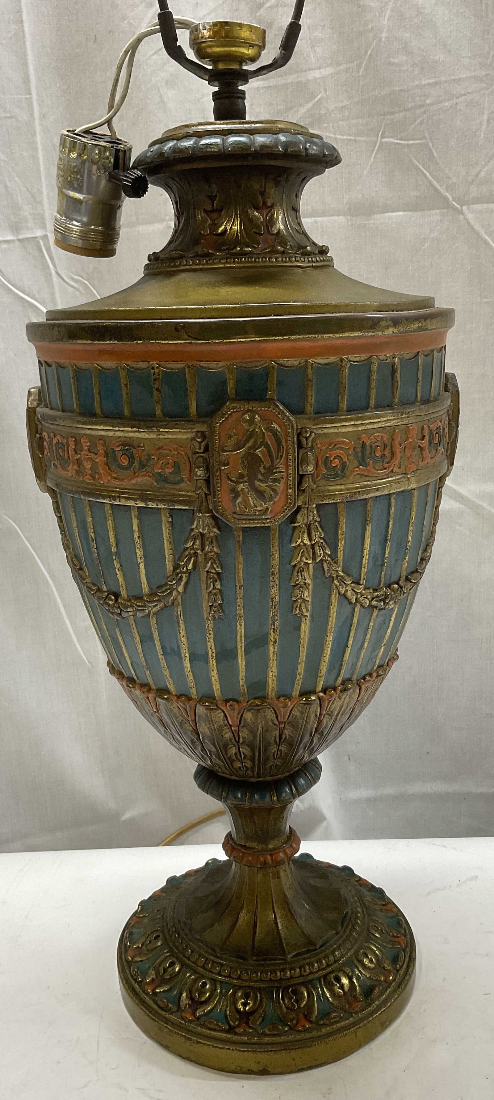 Vintage Neoclassical-Style Urn Shaped Lamp: Vintage Neoclassical-Style Urn Shaped Lamp. Composite Metal Material with Painted Gilt, Teal, and Orange Tones. Drapery and Medallion Motifs. Has Significant Weight. Condition Consistent with Exposure