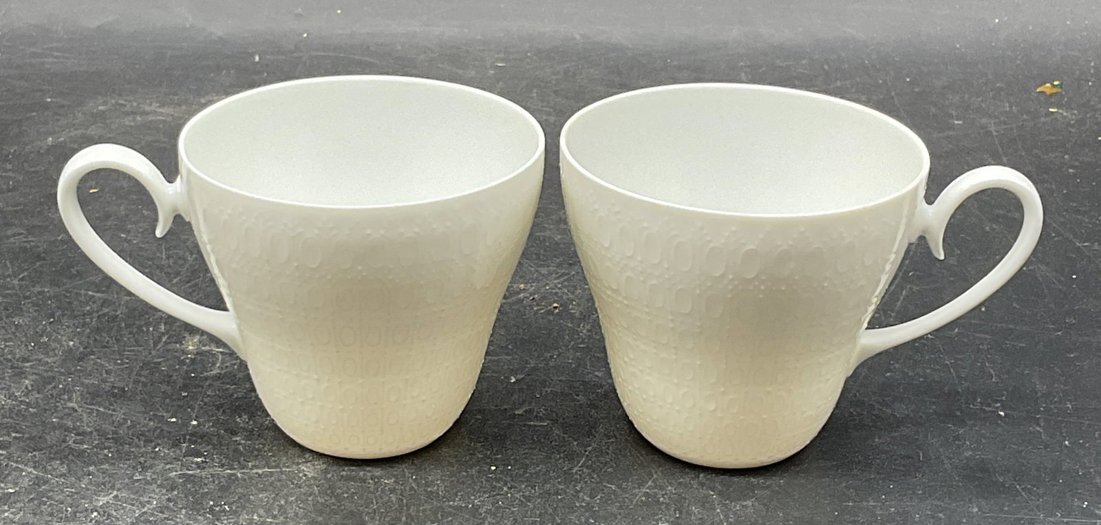 Pair Rosenthal Romance Porcelain Teacups: Pair of Classic Rose Rosenthal white porcelain teacups in Romance pattern. Made in Germany. Measures approx. 3 x 2.75 inches. Some scratching. Rosenthal teacup, romance teacup, porcelain teacups,