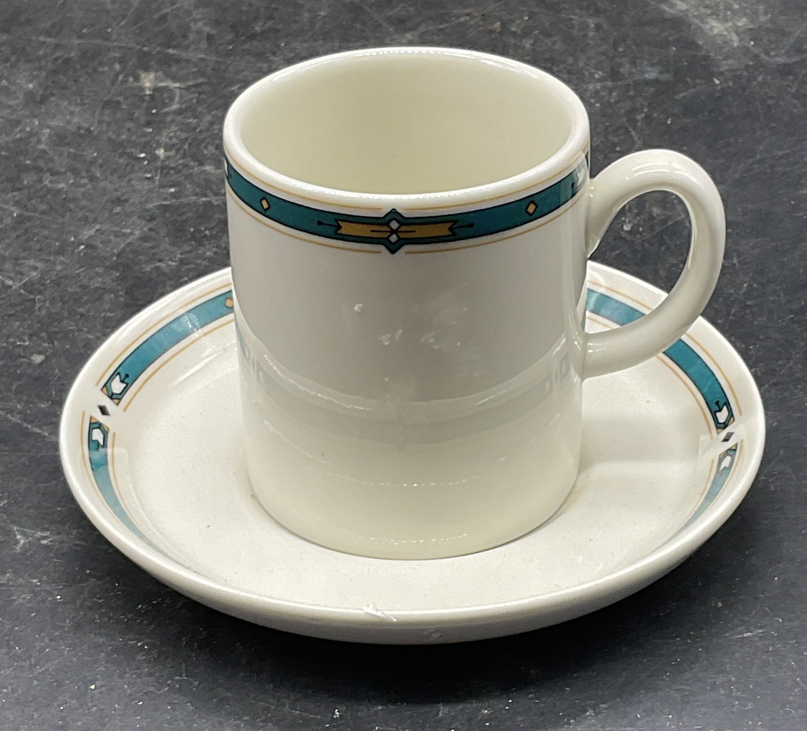 Royal Tuscan Wedgwood Demitasse & Saucer: Vintage Royal Tuscan by Josiah Wedgwood & Sons ceramic demitasse cup and creamer. Made in England. Cup measures approx. 2.25 x 2.5 inches. Saucer measures approx. 4.5 inches wide. Some scratching.