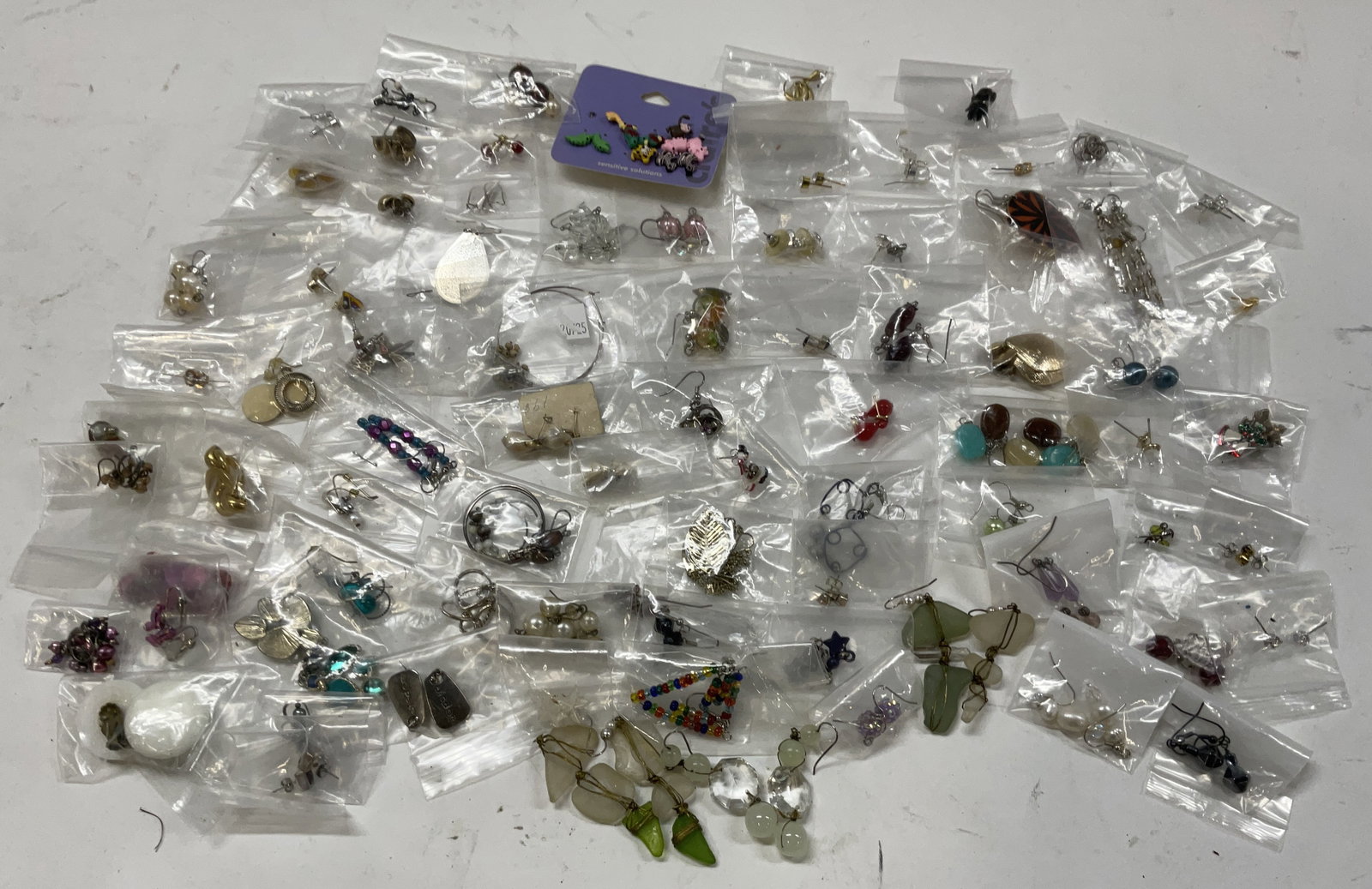 Group Lot 80+ Earrings: Group Lot of 80+ Earrings. Includes Studs, Dangle Earrings, Beaded Earrings, Hoops, Animal Earrings, Holiday Earrings, Ocean Glass Earrings and More. Some Singles. Earrings, Jewelry Lot, Jewelry