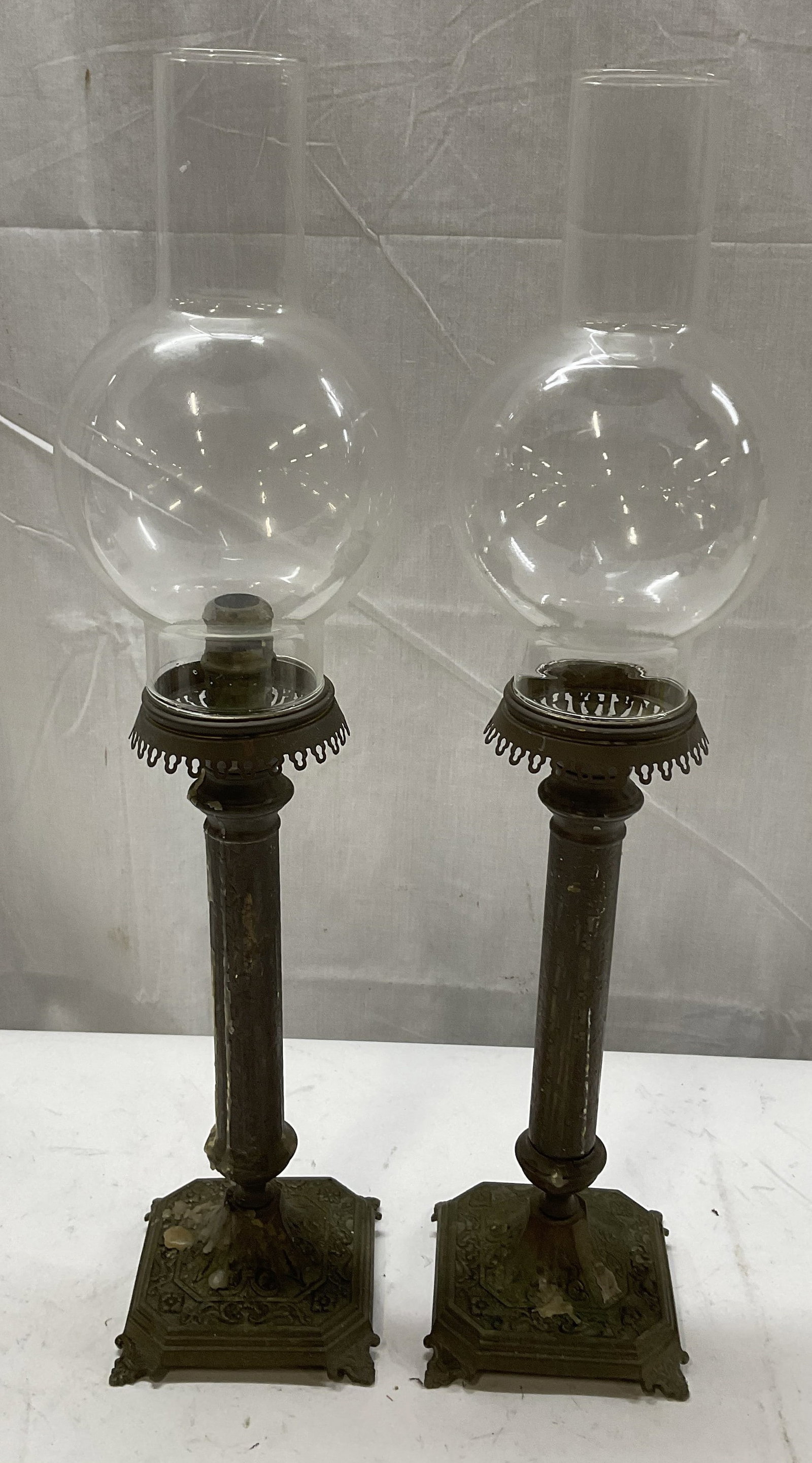 ANTIQUE Brass Column Lamp Bases: Antique Brass Column Lamp Bases with Glass Hurricane Globe Shades. Some Aging to Metal and Residue Present. Crack in Shade. Measures app 20.5in H with Shade x 4in Base. Antique Lamp Bases, Brass Lamp 