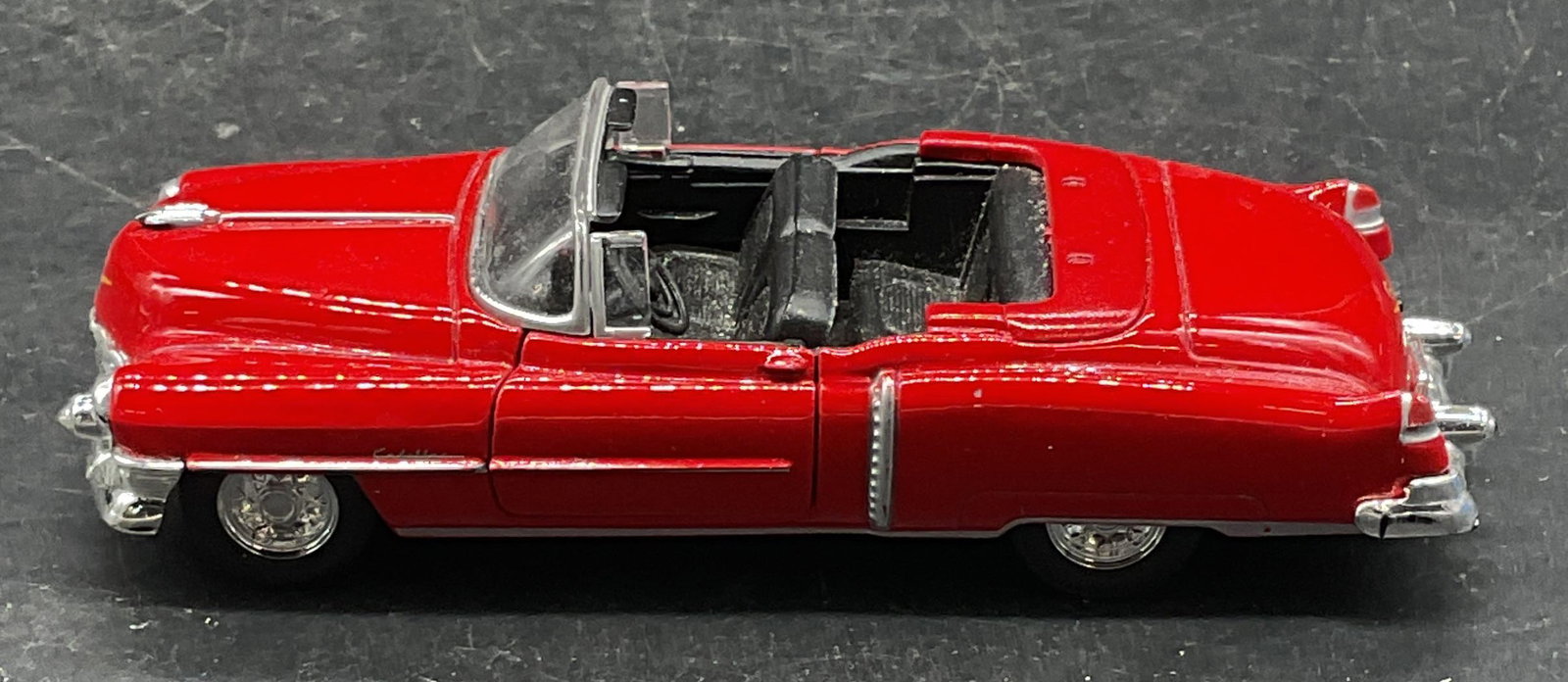 Welly Model Car 1953 Cadillac Eldorado: Welly model car. 1953 Cadillac Eldorado in red. Measures approx. 4.75 x 1.75 x 1.25 inches. Some scratching and losses. Welly model car, model car, toy car, collectibles, home decor, table decor, 10 s