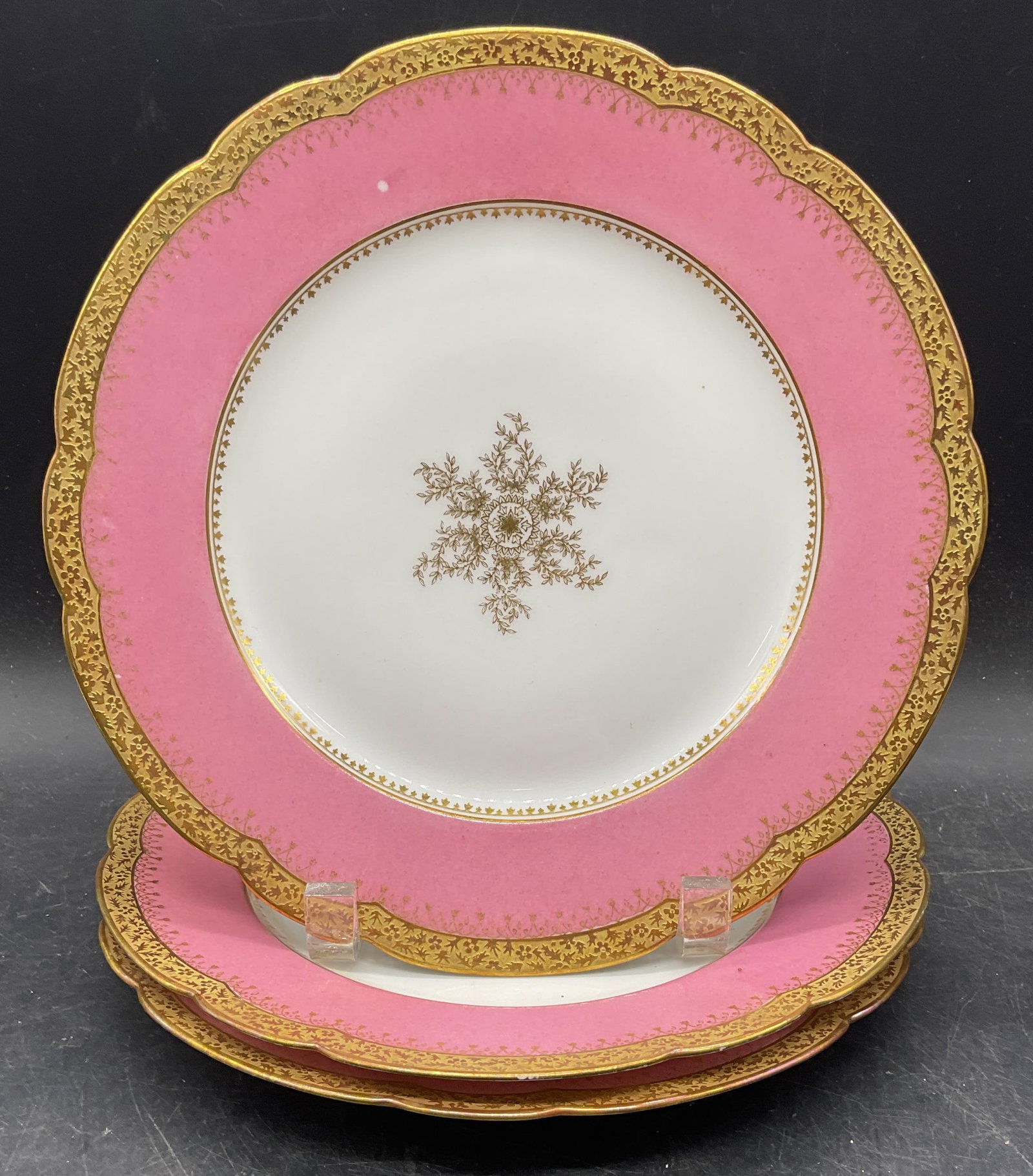 Set 3 Antique Ahrenfeldt Limoges Porc Plates: Set of 3 antique Charles Ahrenfeldt Limoges porcelain plates. Made in France. Pink borders with gilt decorated rims and centers. Measures approx. 9.5 inches wide. Some scratching and loss to paint on 