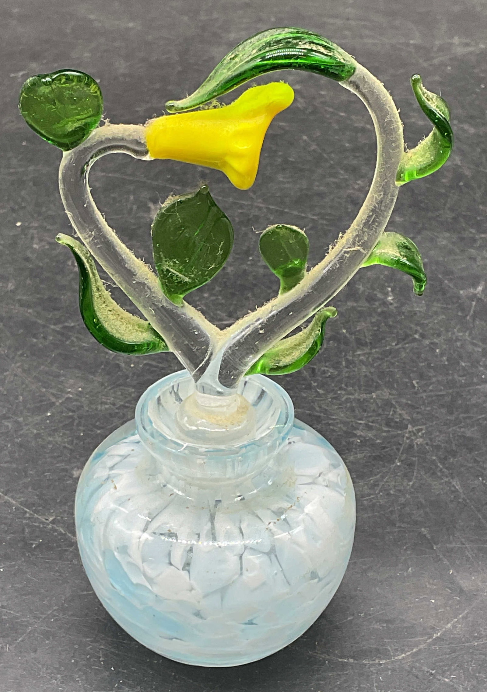 Hand Blown Art Glass Flower Perfume Bottle: Hand blown art glass perfume bottle with flower motif stopper. Mottled blue. Measures approx. 2.25 x 2 inches. Stopper measures approx. 3.5 inches long. Some scratching. Art glass perfume bottle, flow