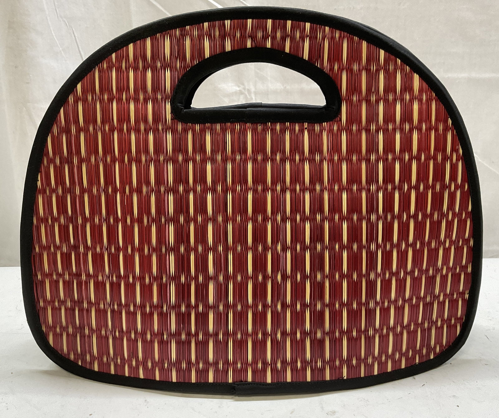 Baskets of Cambodia Woven Tatami Grass Bag: Baskets of Cambodia Woven Red & Tan Tatami Grass Bag. Linen Interior. Canvas Bottom and Sides. Condition Consistent with Exposure. Measures app 12in H x 15in L. Baskets of Cambodia, Cambodia, Asia, Wo
