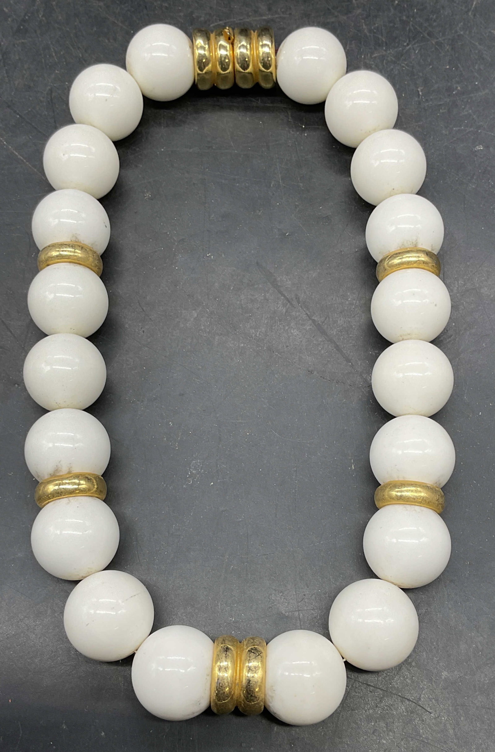 Vintage Gold Tn White Chunky Beaded Necklace: Vintage white chunky beaded necklace with gold tone accents. Drop length 7 inches. Some scratching. Jewelry, estate jewelry, costume jewelry, cocktail jewelry, fashion jewelry, accessories, fashion ac