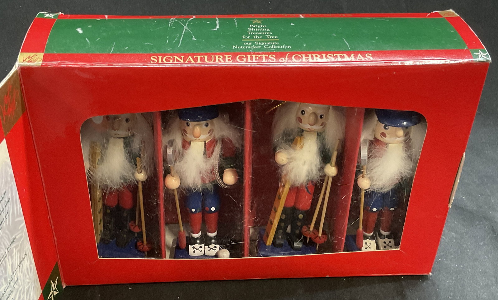 VTG Lord & Taylor Nutcracker Ornaments: Vintage Lord & Taylor Signature Gifts of Christmas Wooden Nutcracker Ornaments. 2 are Depicted Skiing and 2 are Depicted Golfing. One Hat Needs Repair. Measures app 5.25in H x 1.5in Base. Vintage