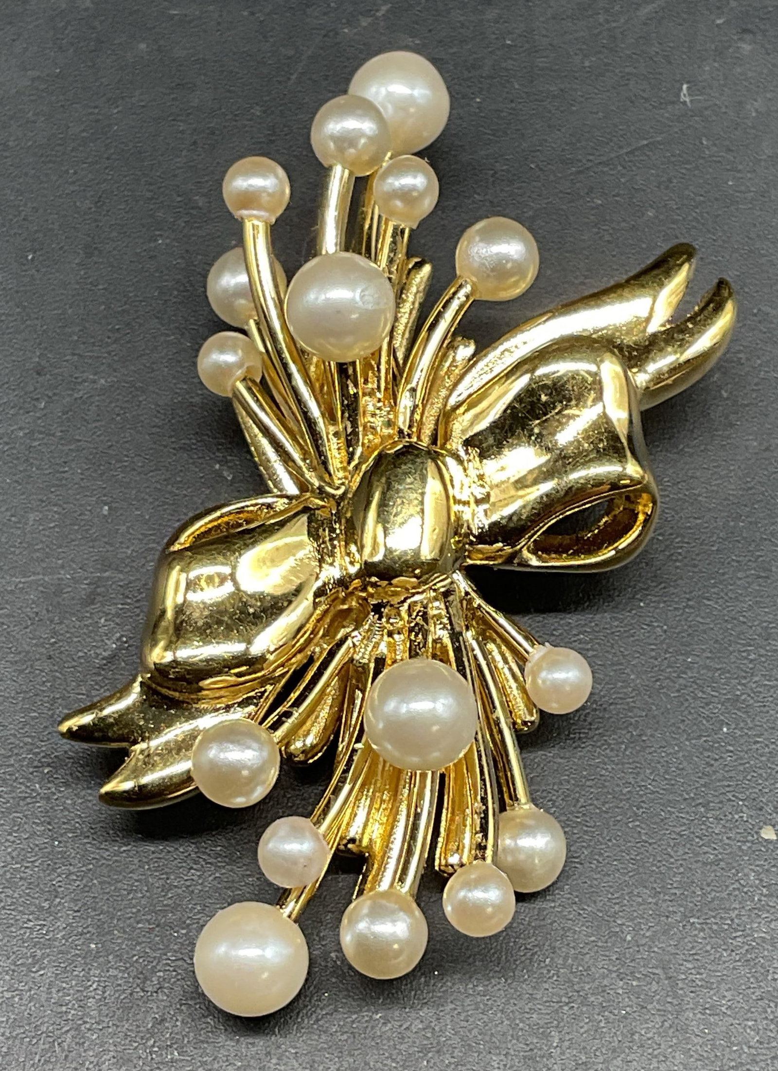 Vintage Napier Gold Tone Faux Pearl Brooch: Vintage signed Napier gold tone and faux pearl floral motif brooch. Measures approx. 1.75 x 1.25 inches. Some scratching. Jewelry, estate jewelry, costume jewelry, cocktail jewelry, fashion jewelry,