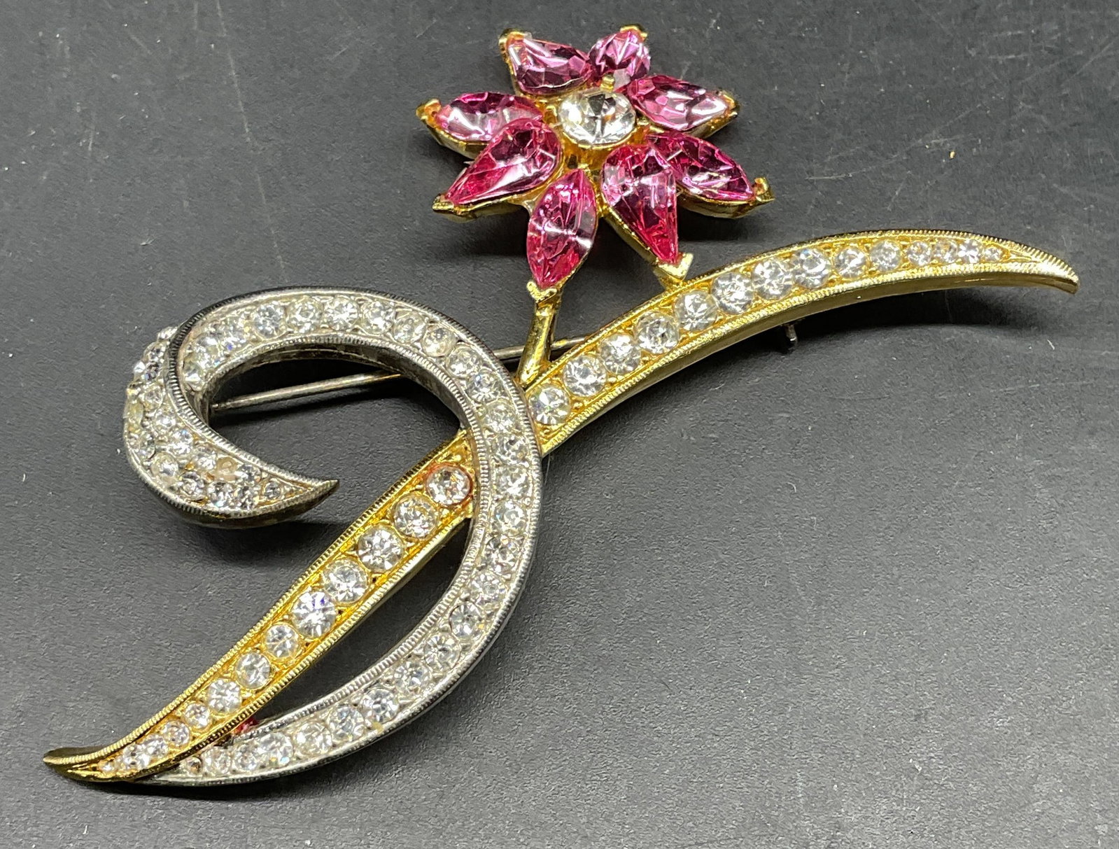 Vintage Todd Anthony Crystal Flower Brooch: Vintage signed Todd Anthony silver and gold tone flower brooch with pink and colorless crystals. Measures approx. 2.75 x 2.75 inches. Some scratching. Jewelry, estate jewelry, costume jewelry, cocktai