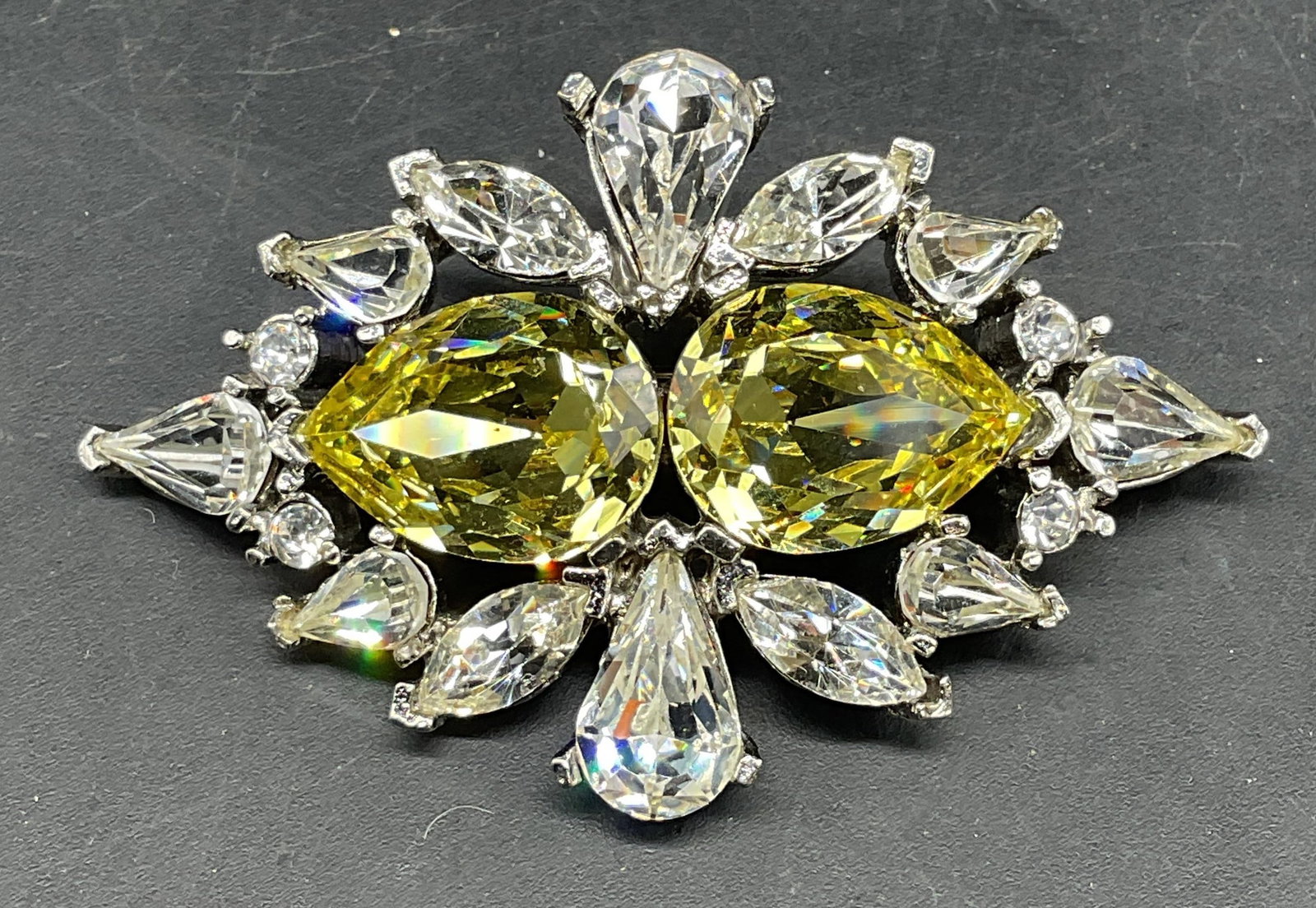 Vintage Todd Anthony Art Deco Style Crystal Brooch: Vintage signed Todd Anthony silver tone art deco style brooch with green and colorless crystals. Measures approx. 1.25 x 2.5 inches. Some scratching. Jewelry, estate jewelry, costume jewelry,