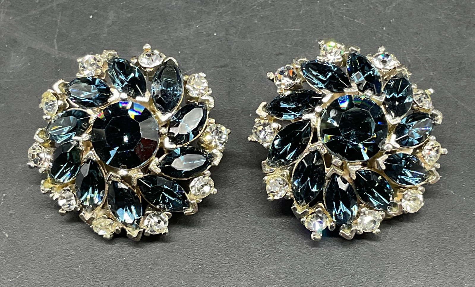 Vintage Todd Anthony Blue Crystal Flower Earrings: Vintage signed Todd Anthony silver tone flower earrings with blue and colorless crystals. Measures approx. 1.25 inches wide. Some scratching. Jewelry, estate jewelry, costume jewelry, cocktail