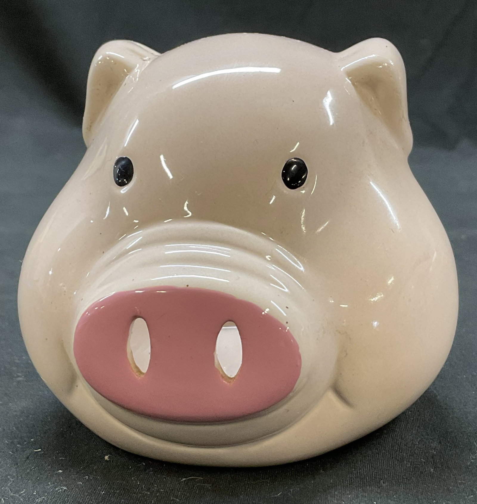 Vintage Ceramic Pig Planter: Vintage ceramic pig planter. Pig face figure. Hand painted details. Light pink color. Glossy finish. Measures approx 2.5 x 6 x 3.5 inches. Surface wear consistent with exposure. Planter, pig planter, 