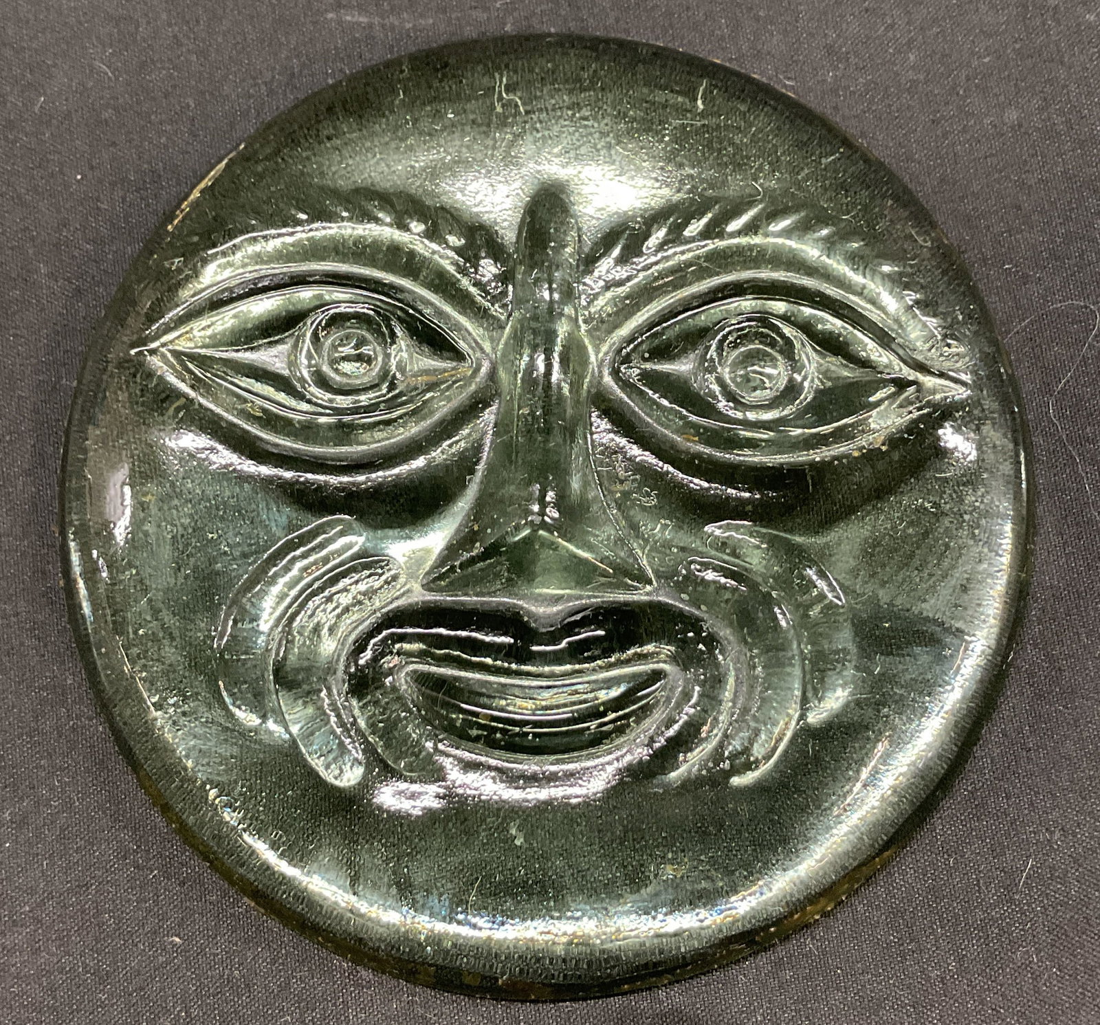 Vintage Clear Glass Moon Face Figure: Vintage clear glass hand blown moon face figure. Circular shape. Hand carved facial features. Detailed. Measures approx 4 inches in diameter. Some scratching. Moon face figure, decor, home decor, home