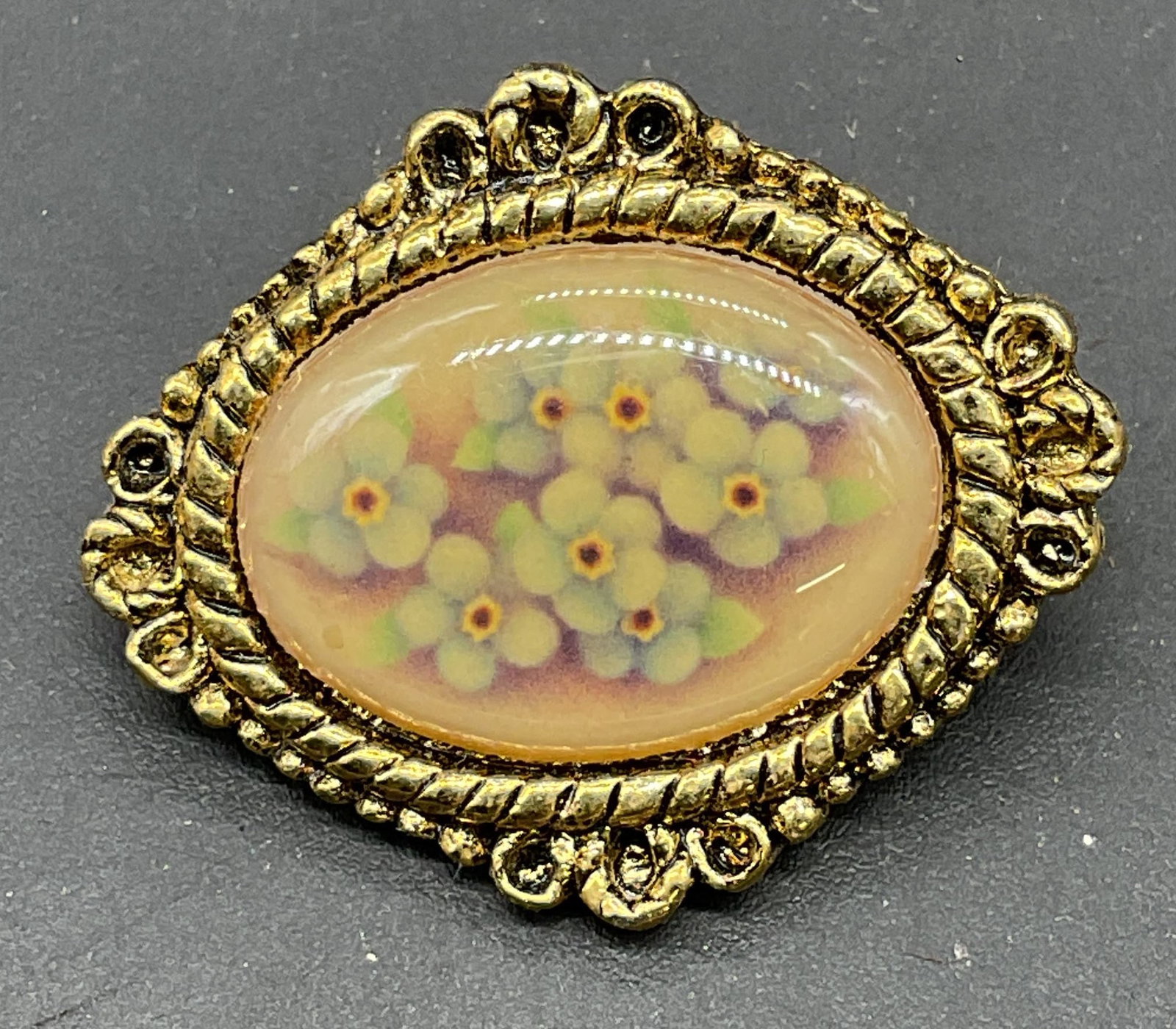 Vintage Camco Gold Tone Flower Brooch: Vintage Camco gold tone brooch with flower motif. Reads Gods love is with you always on reverse. Measures approx. 1 x 1 inches. Some scratching. Jewelry, estate jewelry, costume jewelry, cocktail jewe
