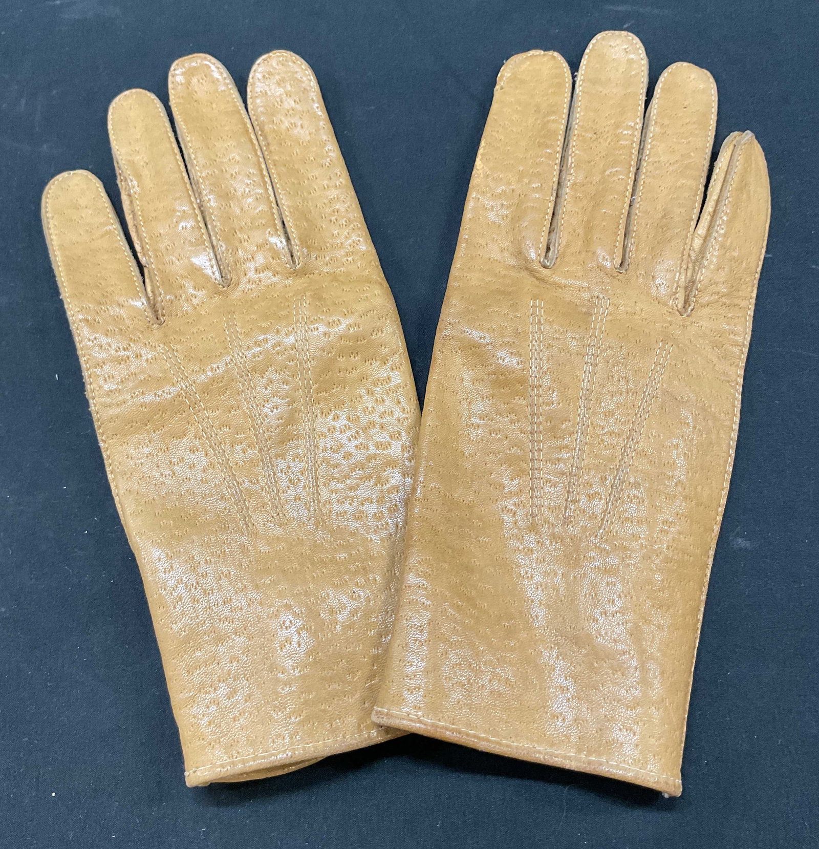 Entry Brown Leather Gloves: Entry brown leather gloves. Marked Entry on buttons. Marked size 10. Unique design and stitching. Wear consistent with exposure, blemishes. Gloves, Entry, wearables, clothing, outerwear, accessories, 