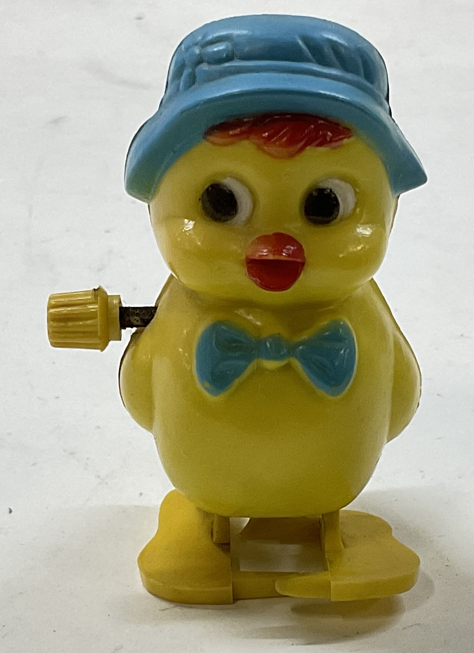 Vintage Wind-Up Blue Bonnet Chick Toy: Vintage Wind-Up Blue Bonnet Chick Toy. Condition Consistent with Exposure. Not Tested for Functionality. Measures app 2.75in H x 1.25in W. Vintage Wind-Up Toy, Blue Bonnet, Chick, Chickens, Animals,