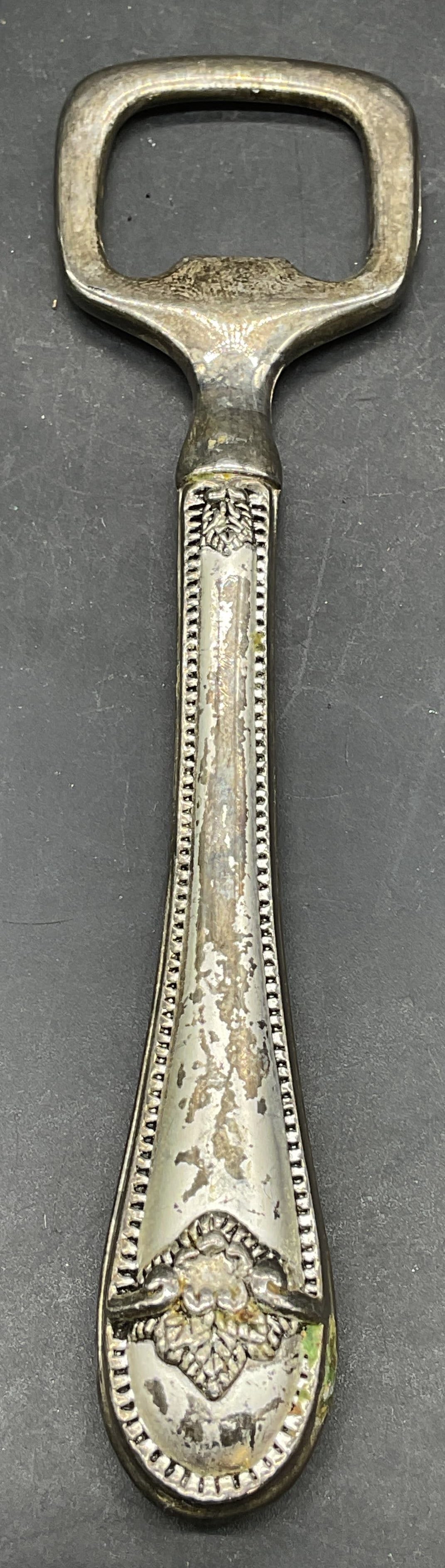 Vintage Silver Plated Ornate Bottle Opener: Vintage silver plated ornate handle bottle opener. Measures approx. 5 inches long. Silver plated bottle opener, ornate bottle opener, vintage bottle opener, home accessories, table accessories, 10 s