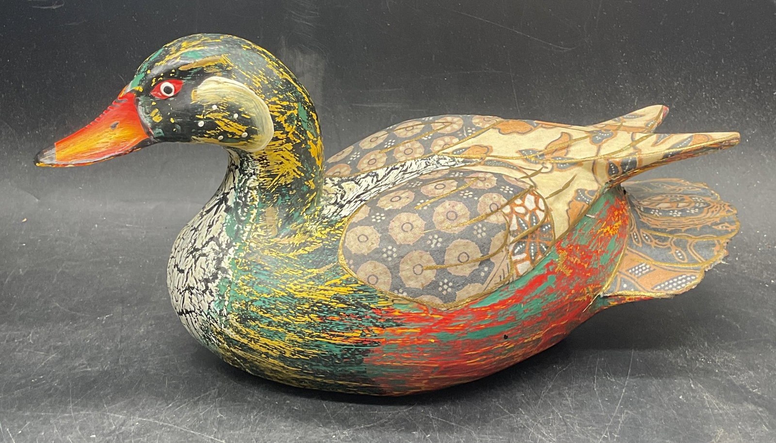 Vintage Hand Painted Wood Decoy Duck: Vintage hand painted caved wood decoy Duck. Fabric overlay with gilt decoration. Measures approx. 11.5 x 5 x 5.5 inches. Some scratching and loss to paint. Decoy duck, decorative decoy duck,