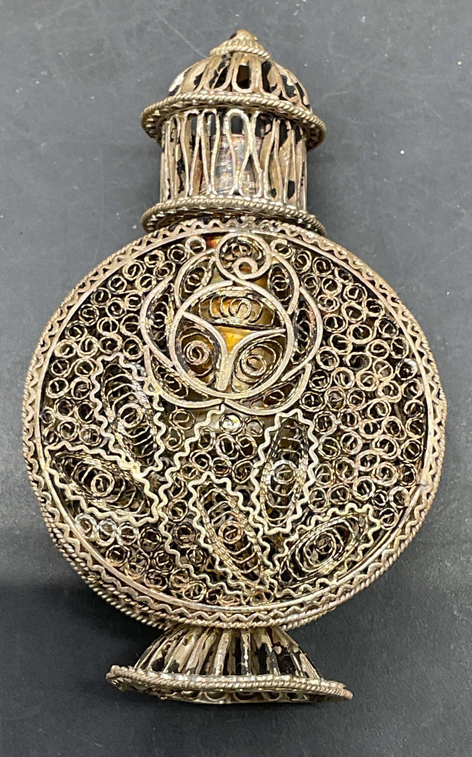 Signed 950 Silver Filigree Perfume Bottle: Vintage signed 950 silver perfume bottle, ornate filigree design with footed base. Marked 950, signed with hallmark illegibly. Measures approx. 1.5 x .75 x 2.5 inches. Total weight 26.6 grams. Wear
