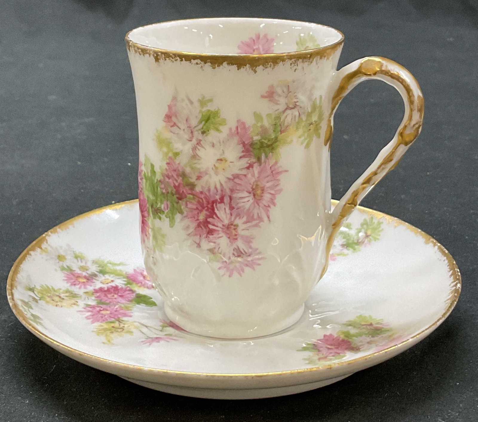 Set 2 Haviland GDA Limoges Teacup & Saucer France: Set of 2 Charles Field Haviland GDA Limoges porcelain teacup and saucer. Marked on underside, reads GDA France CH Field Haviland Limoges. Gilt accents. Pink and green floral motifs. Embossed leaf