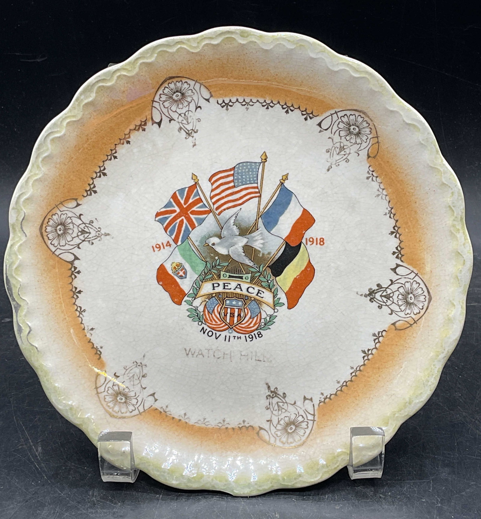 Antique WWI McNicol Commemorative Ceramic Plate: Antique circa 1920s D. E. McNicol World War I commemorative Watch Hill ceramic plate. Hand painted and gilt. Made in England. Measures approx. 7.25 inches wide. Wear including crazing, scratching, los