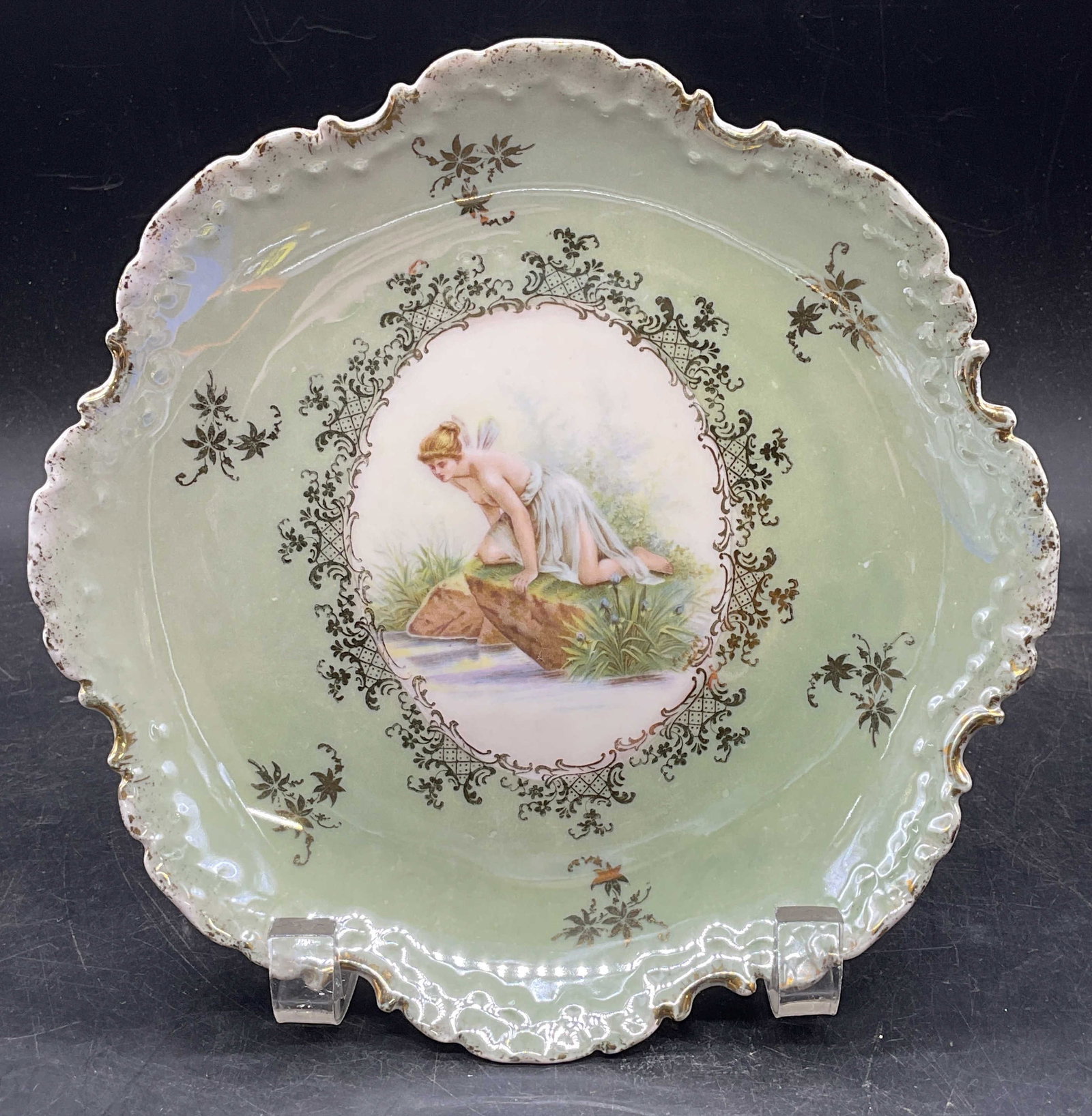 Antq Rosenthal Monbijou Fairy Porc Plate Germany: Antique RC Rosenthal Monbijou porcelain plate. Hand painted and gilt fairy motif with scalloped edge. Made in Germany. Measures approx. 7.75 inches wide. Some scratching and loss to paint. Antiques, c