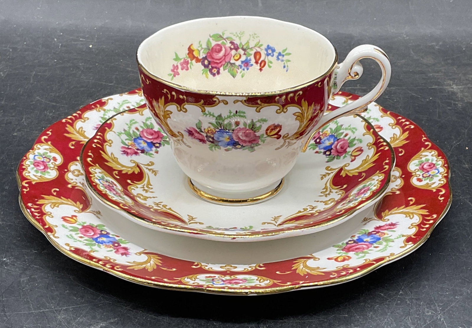 Set 3 Royal Standard Teacup, Saucer & Plate: Set of 3 Royal Standard fine bone china teacup, saucer, and dessert plate. Lady Fayre floral pattern in red. Larger plate measures approx. 7.75 inches. Teacup measures approx. 3.5 x 2.75 inches. Made 