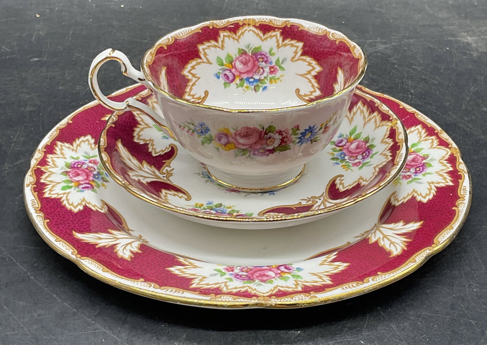 Set 3 Royal Grafton China Teacup, Saucer, Plate: Set of 3 Royal Grafton bone china teacup, saucer, and dessert plate. Academy floral pattern in red. Larger plate measures approx. 7.75 inches. Teacup measures approx. 3.5 x 2.75 inches. Made in Englan