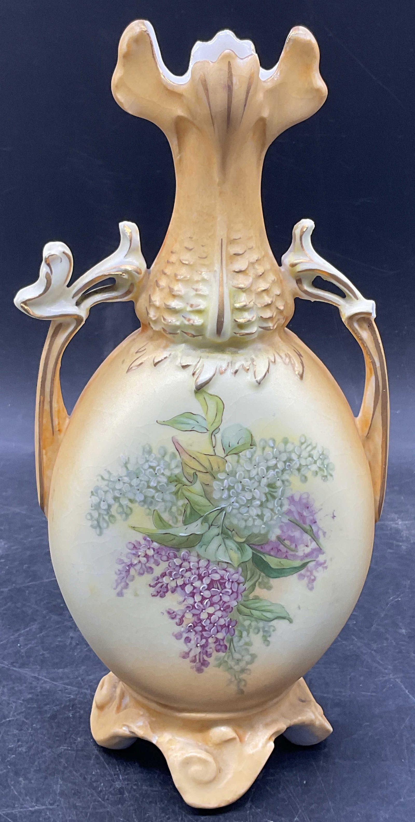 Antique Robert Hanke Floral Porc Vase Austria: Antique RH Robert Hanke porcelain vase with ornate footed base and scalloped rim. Hand painted and gilt floral design. Made in Austria. Measures approx. 4 x 2.5 x 9 inches. Wear including scratching,