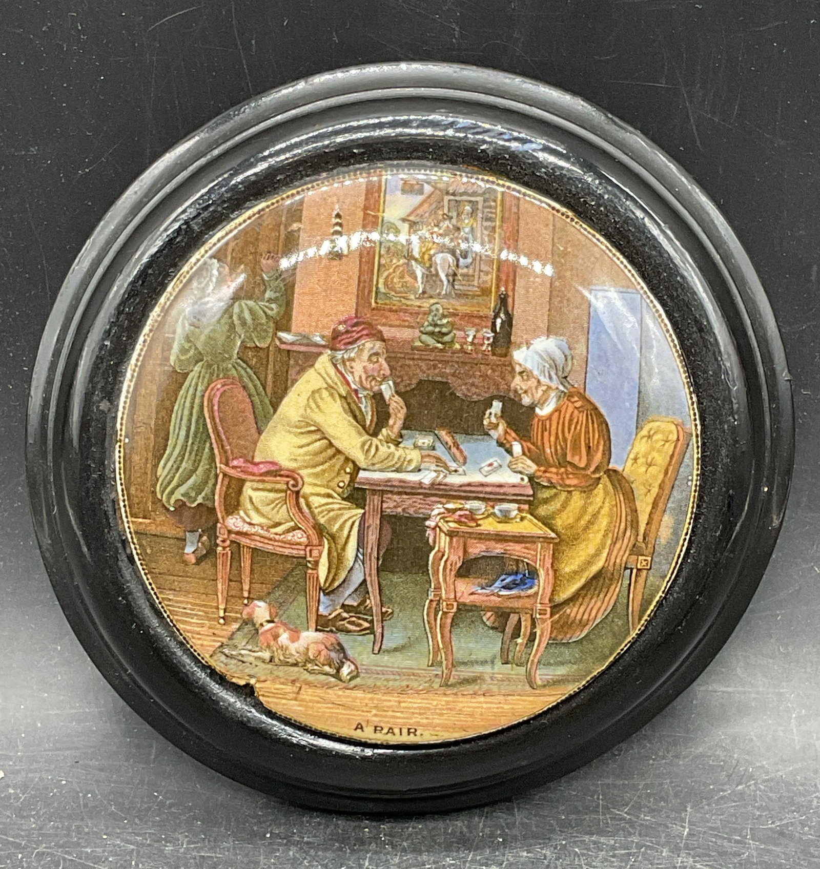 Antique Prattware Couple Pottery Lid: Antique Victorian Prattware pottery lid. Transferware print scene. A Pair. Couple playing cards. Black wood frame. Not examined out of frame. Frame measures approx. 5.5 inches wide. Wear including cra