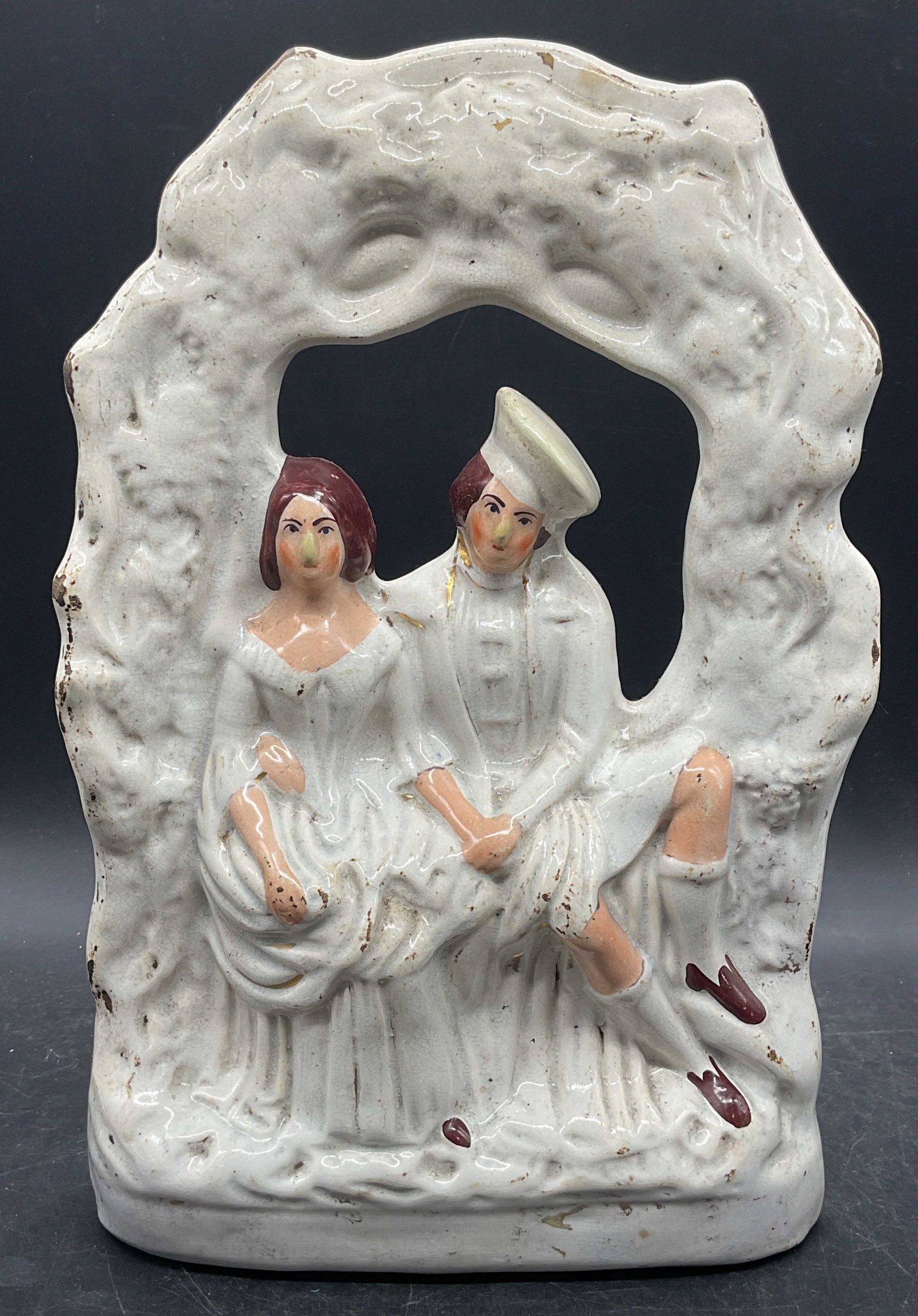 Antique Pottery Wedding Figure 13.5 Inches Tall: Antique English Staffordshire style pottery figure, wedding couple, bride and groom with arch. Hand painted. Measures approx. 8.5 x 3 x 13.5 inches. Wear including scratching, crazing, loss to paint a