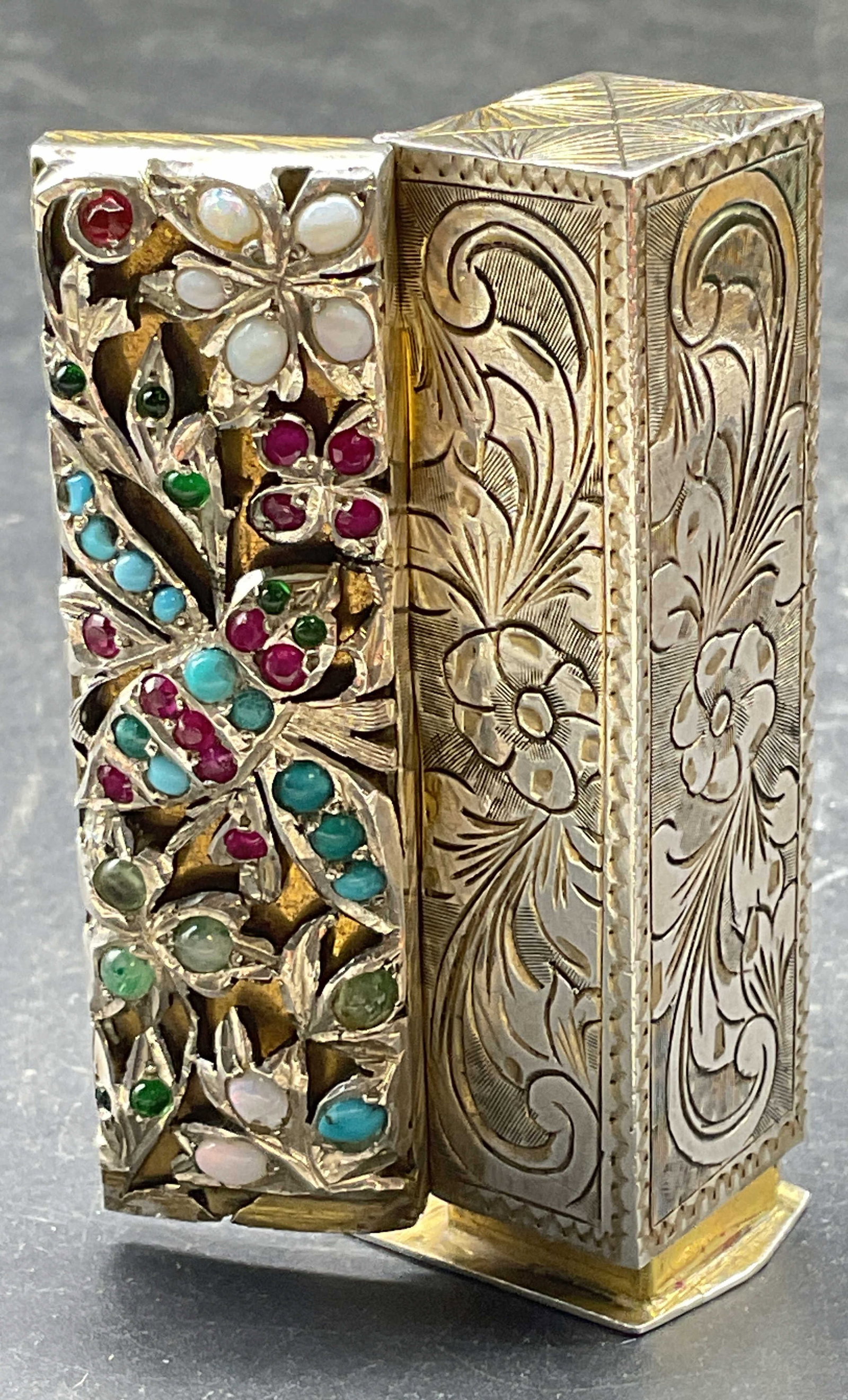 Vintage Silver Jeweled Lipstick Case Italy: Vintage jeweled silver lipstick case. Floral and insect motifs with round colored stone cabochons. Hand chased silver exterior and gold plated interior. Interior spring hinged mirror. Made in Italy. M