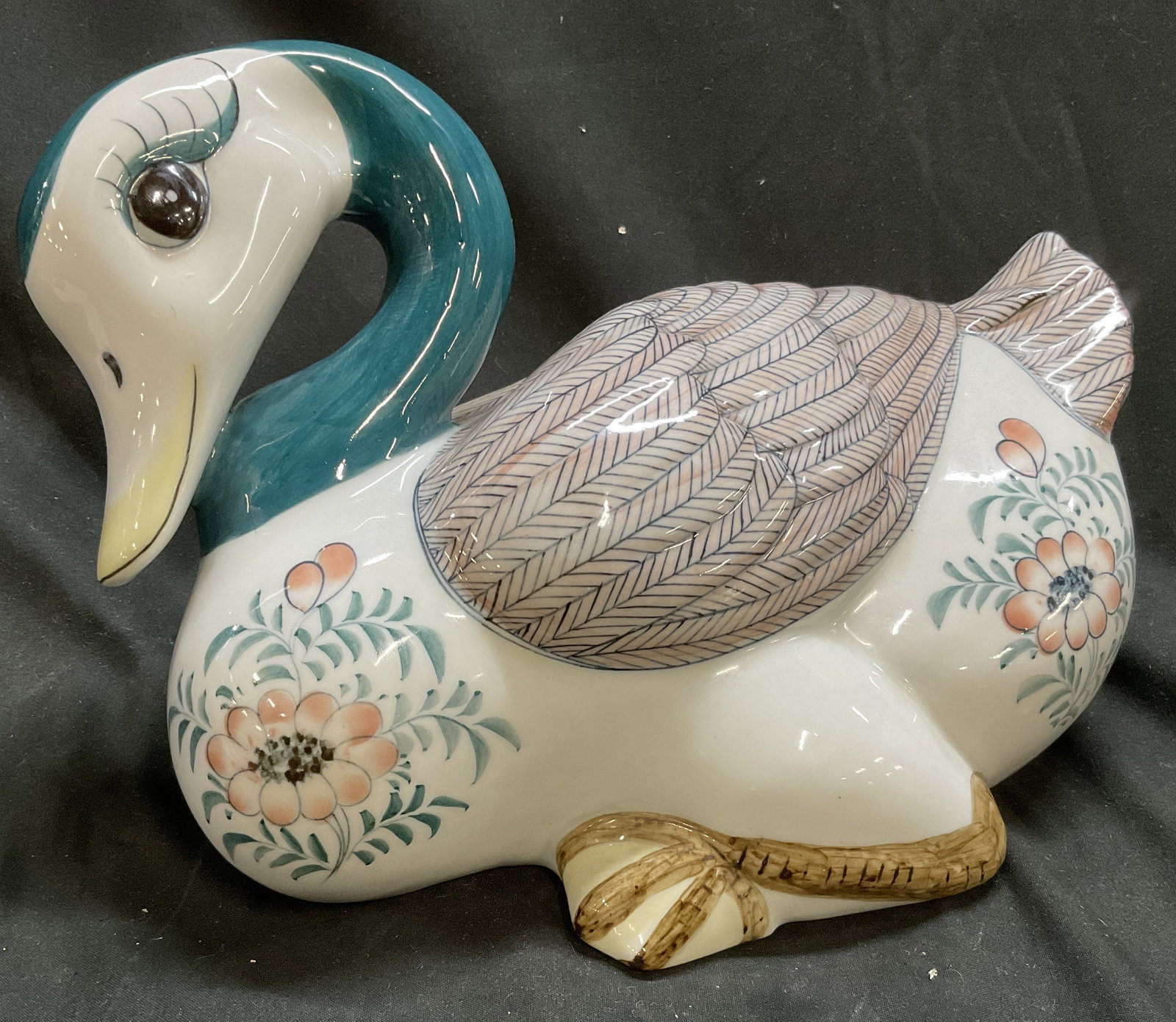 VTG Maitland-Smith Ltd Porcelain Duck Figurine: Vintage Maitland-Smith Ltd Porcelain Duck Figurine. Turquoise Neck. Hand Painted Floral Motifs. Handmade in Thailand. Condition Consistent with Exposure. Measures app 7in H x 9in Diam. Vintage Duck Fi