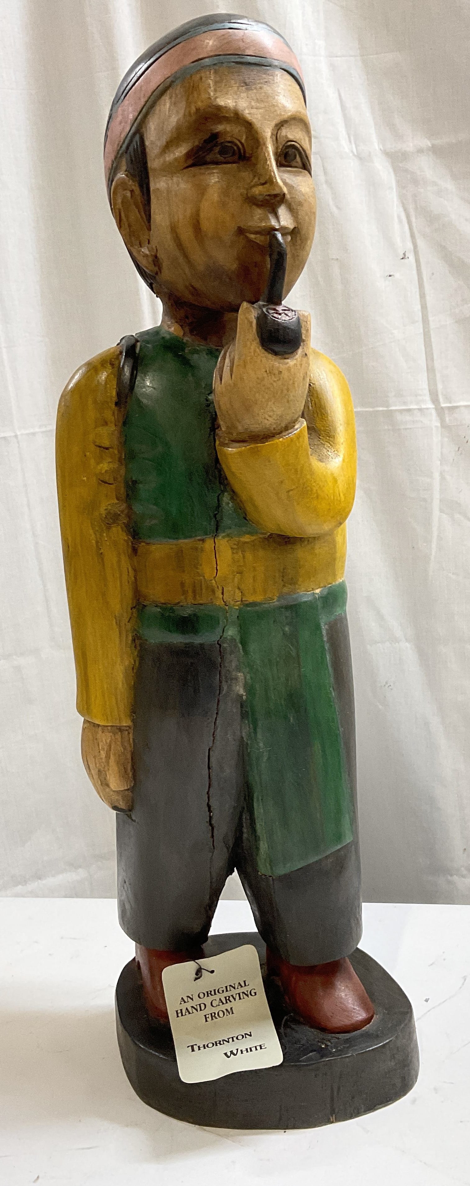 Thornton White Carved 25.5in THAI Folk Art Statue: Thornton White Original Hand-Carved Wooden Folk Art Statue. Made in Thailand by Native Thai Artists Using Wood from the Forest Which is Expected to Develop Splits and Cracks. Depicts a Man with a