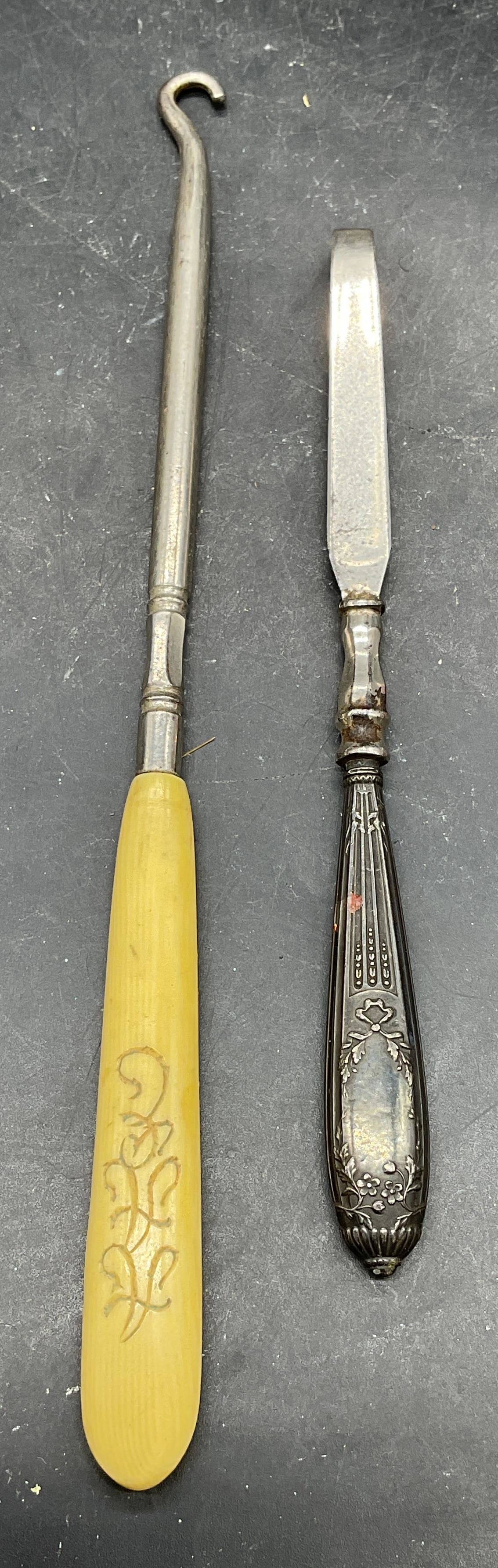 Lot 2 Antique Sterling Silver Tweezer +: Lot of 2 pieces. Antique sterling silver handles tweezers. Measures approx. 5.5 inches long. Tested for sterling. Total weight including non sterling 13.6 grams. Antique Pyralin handled button hook.