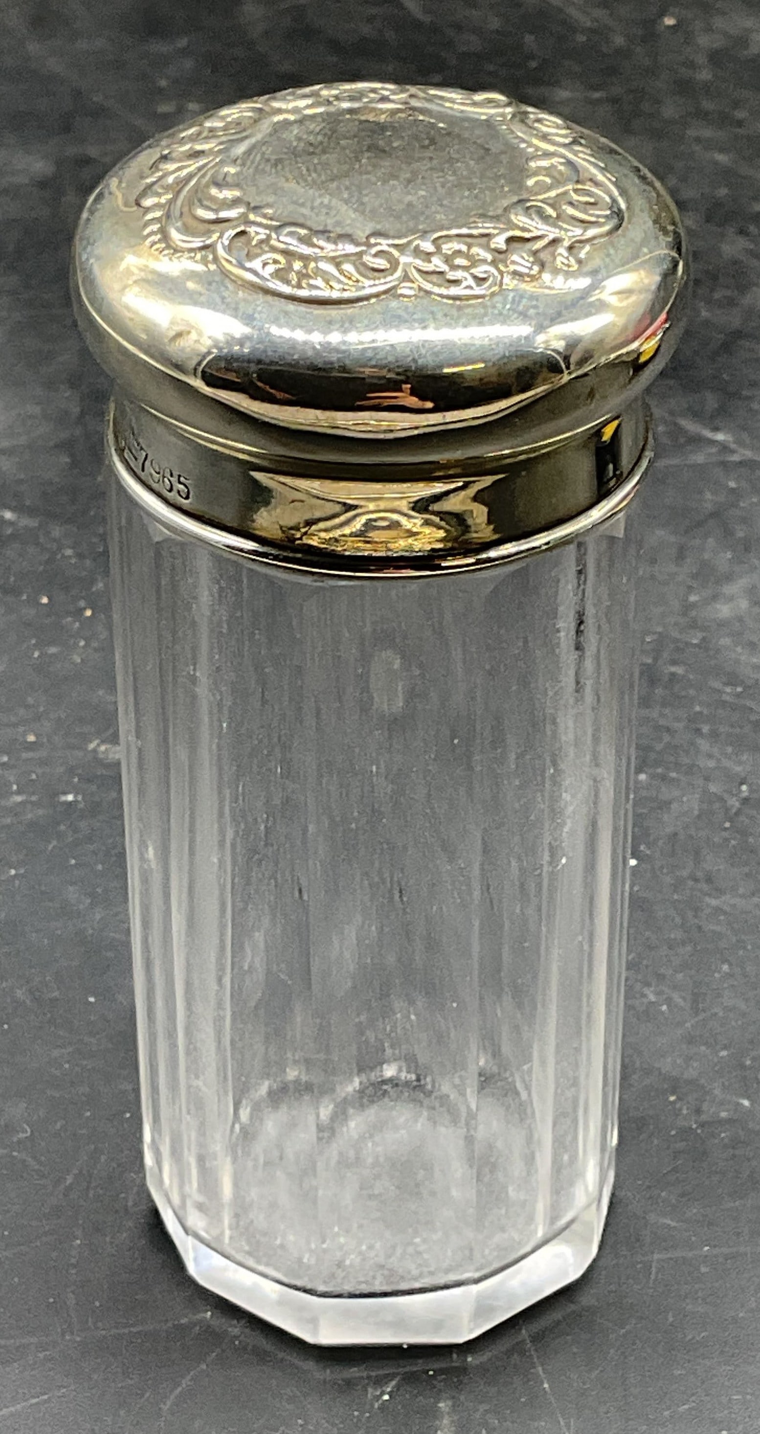 Sgn Vintage Sterling Silver Paneled Glass Jar: Signed vintage paneled glass jar with sterling silver lid. Ornate repousse lid. Marked sterling. Signed IB 7965. Total weight of sterling 10 grams. Measures approx. 1.5 x 3.5 inches. Some scratching.