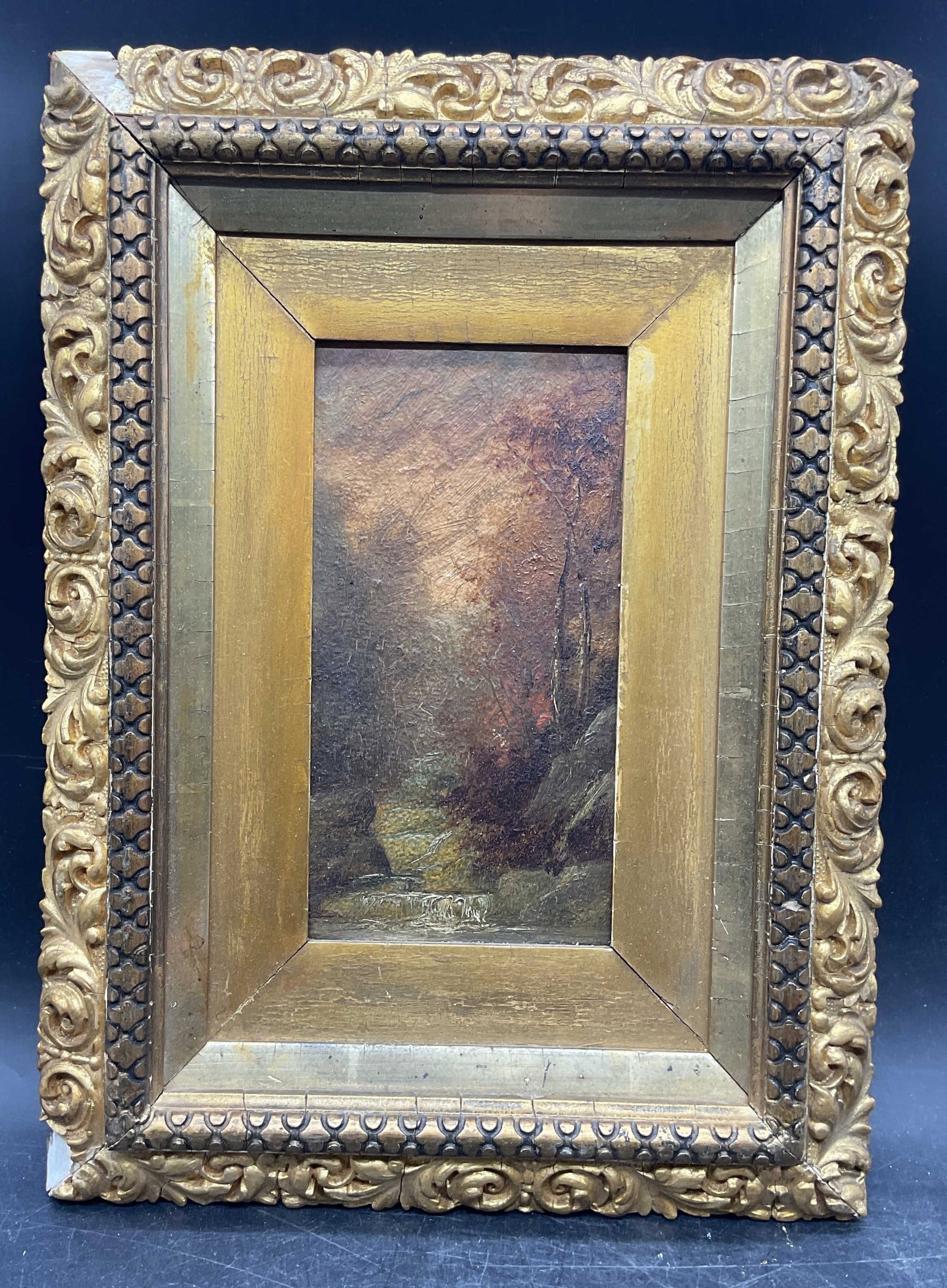 Signed Antique Landscape Stream Oil Painting: Framed oil on board painting. Circa early late 19th or early 20th century. Inscribed and signed on the verso illegibly. Landscape with stream. Ornate gilt wood frame. Not examined out of frame. Frame