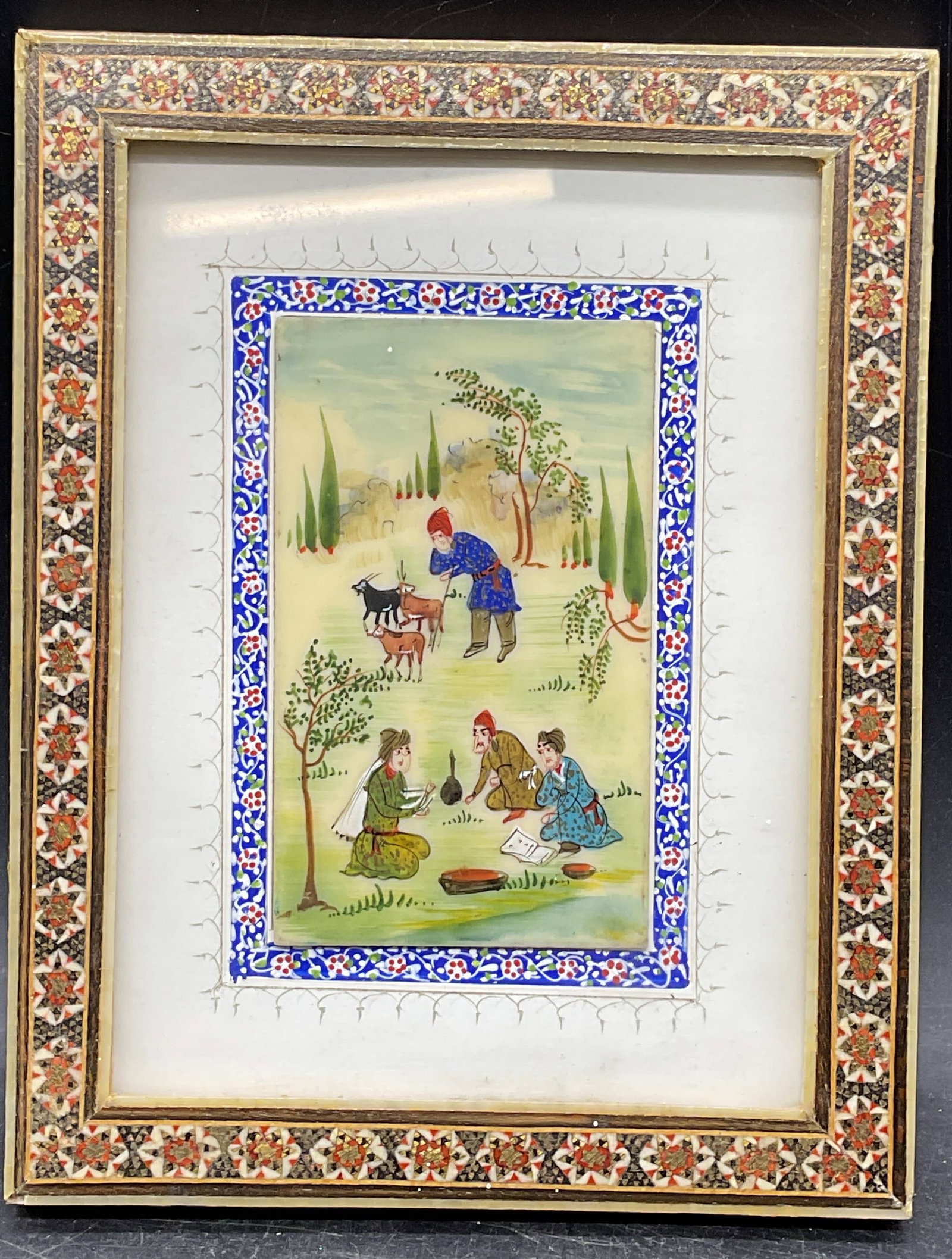 Framed Persian Miniature Pastoral Painting: Framed Persian miniature painting. Pastoral scene with goats and figures. Khatam inlay marquetry frame. Not examined out of frame. Frame measures approx. 7.5 x 5.75 inches. Some losses to frame. Art,