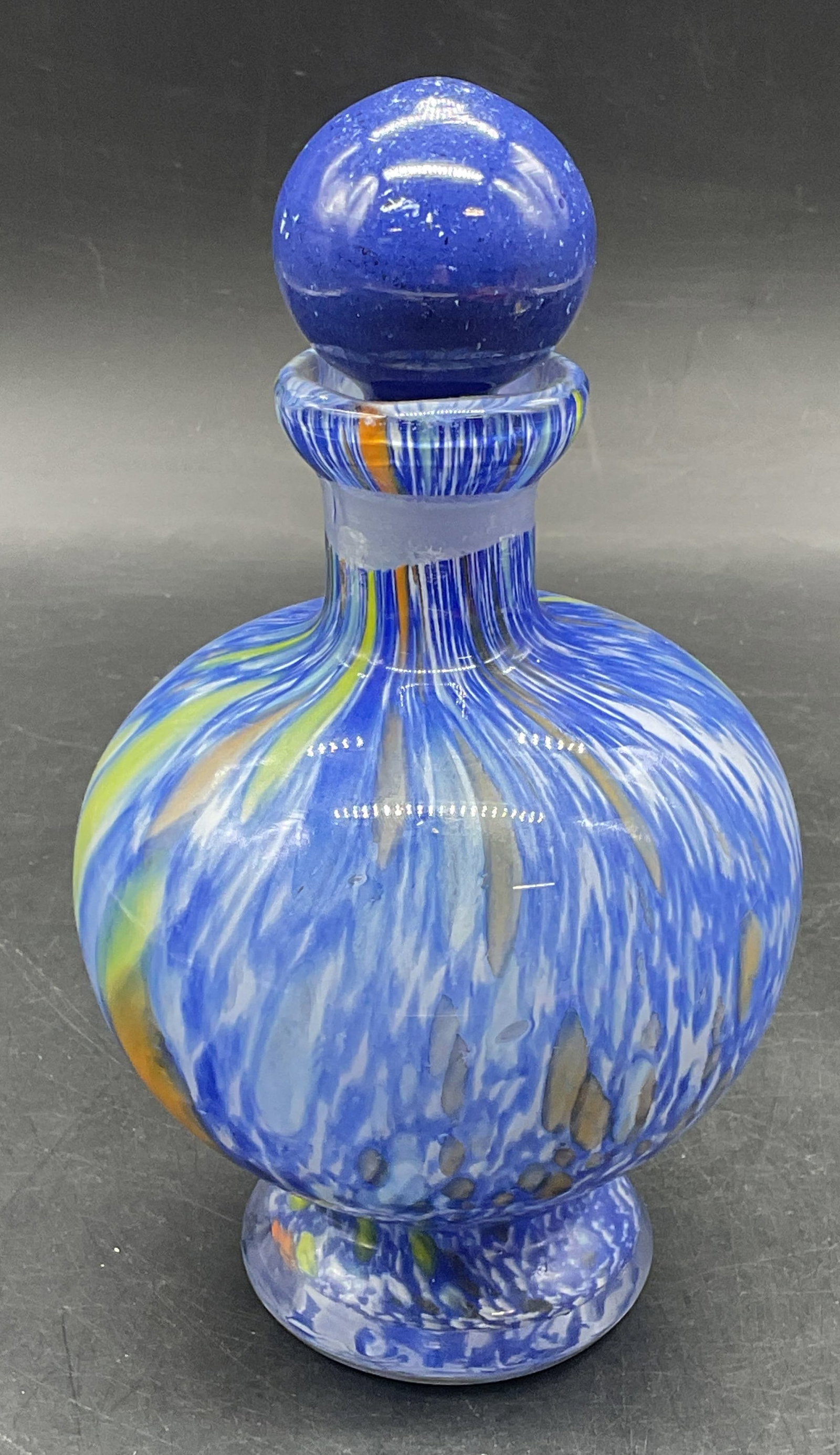 Hand Blown Blue Speckled Art Glass Bottle: Murano style hand blown art glass bottle with stopper. Blue speckled pattern. Measures approx. 3.75 x 5.25 inches excluding stopper. Some scratching. Art glass bottle, collectibles, home decor, home