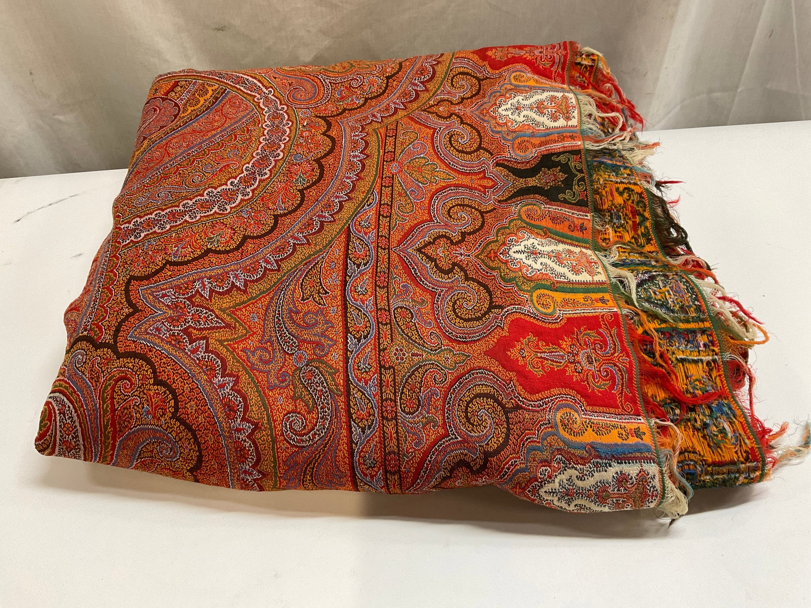ANTIQUE Kashmiri-Style Woven Pashmina Textile: Antique Kashmiri-Style Woven Pashmina Textile. Colorful Paisley Pattern with Fringed Edges. Condition Consistent With Exposure. Measures app 120in L x 58in L. Antique Textiles, Kashmiri-Style, Woven