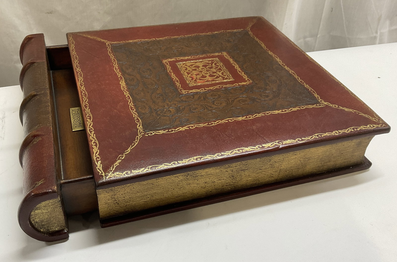 VTG Theodore Alexander Book-Shaped Keepsake Box: Vintage Theodore Alexander Antique Book-Shaped Keepsake Box. Solid Wood Core with Leather Binding and Detailed Gilt Stenciling. Contains Secret Drawer. Spine Reads Old English Houses- Faber. Some