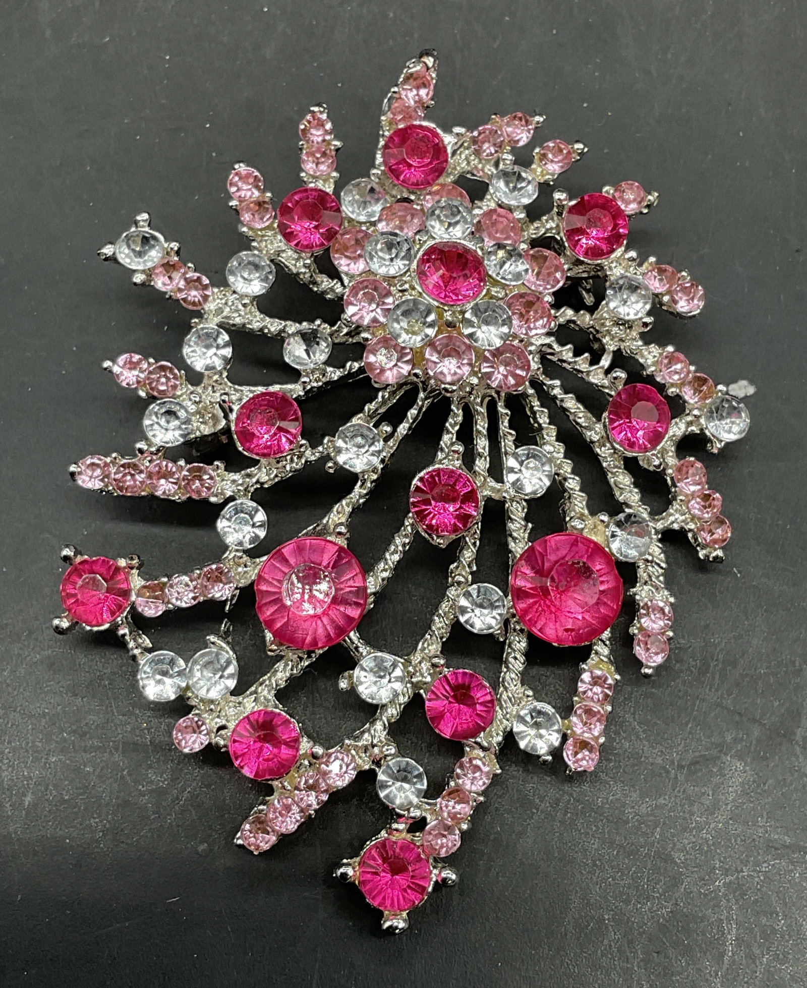 Silver Tone Pink Crystal Brooch: Silver tone brooch with pink and colorless crystals. Measures approx. 2.75 x 2 inches. Some scratching. Jewelry, estate jewelry, costume jewelry, cocktail jewelry, fashion jewelry, accessories,