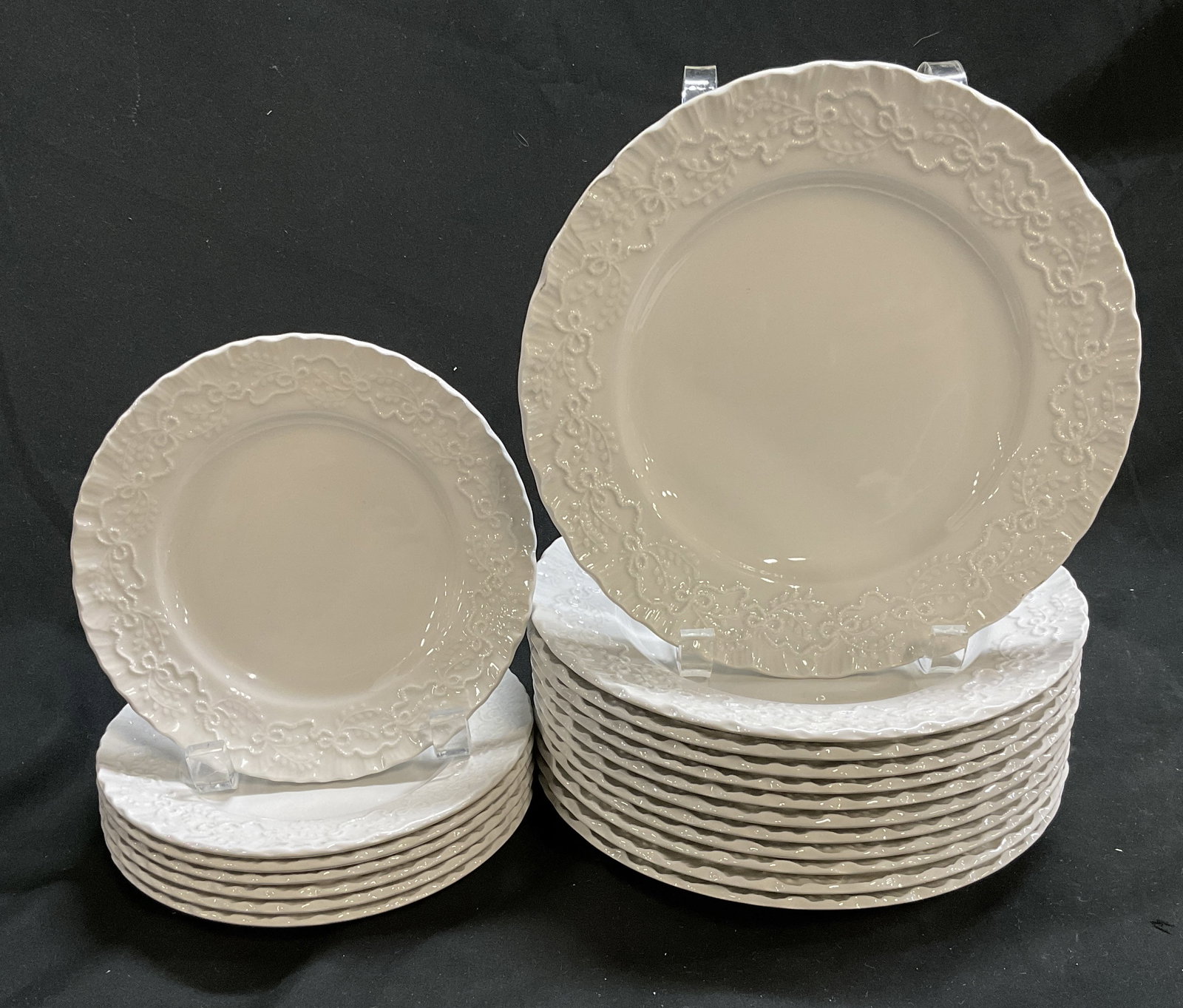 19 Ralph Lauren Wedgwood Claire Plates ENGLD: 19 Ralph Lauren Wedgwood Claire Plates, with Scalloped Edges. Ribbon and Bow Design. England. 12 Lunch Plates and 7 Dessert Plates. Largest Measures app 1in H x 8.25in Diam. Ralph Lauren, Wedgwood,